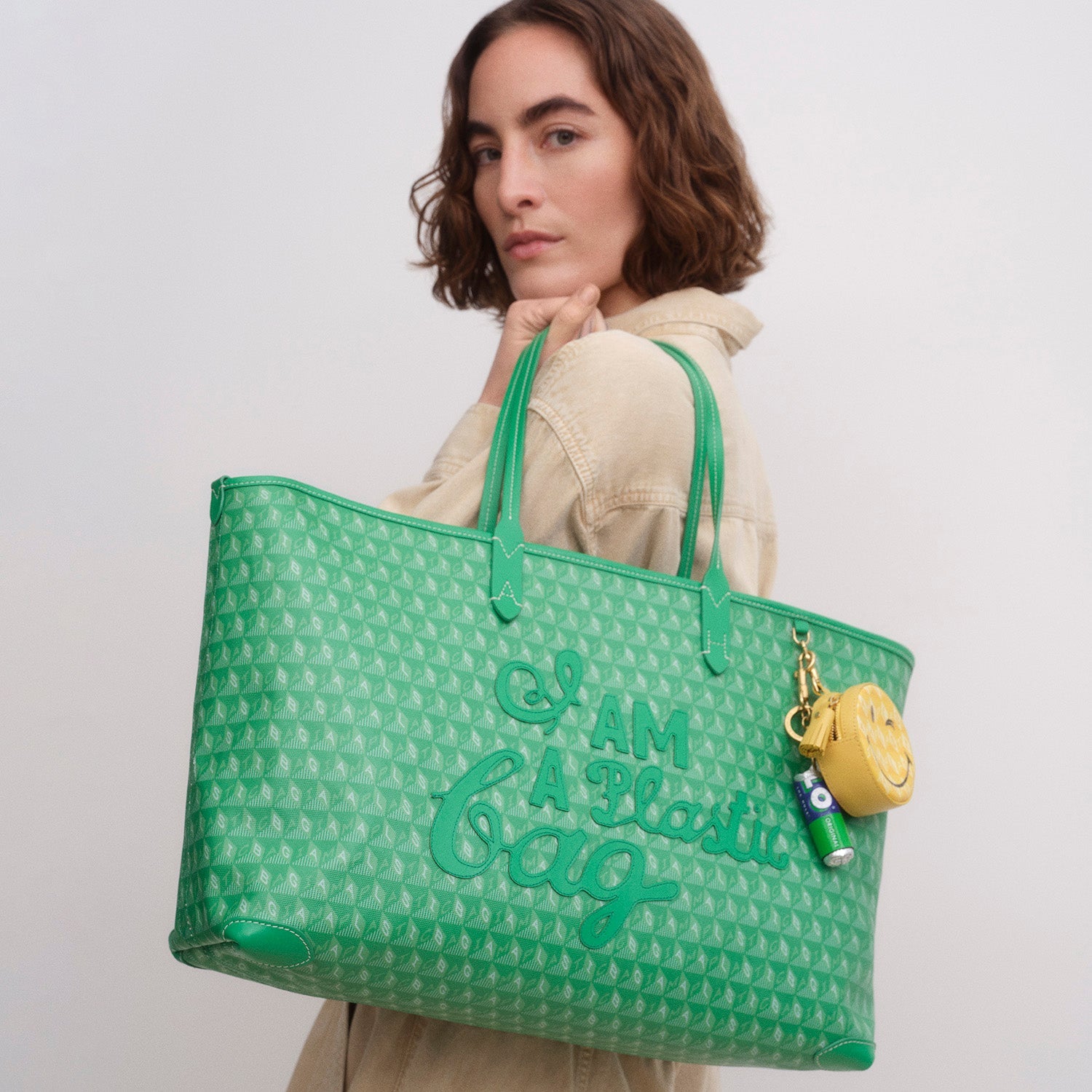 Green tote bag made of recycled plastic by Anya hindmarch