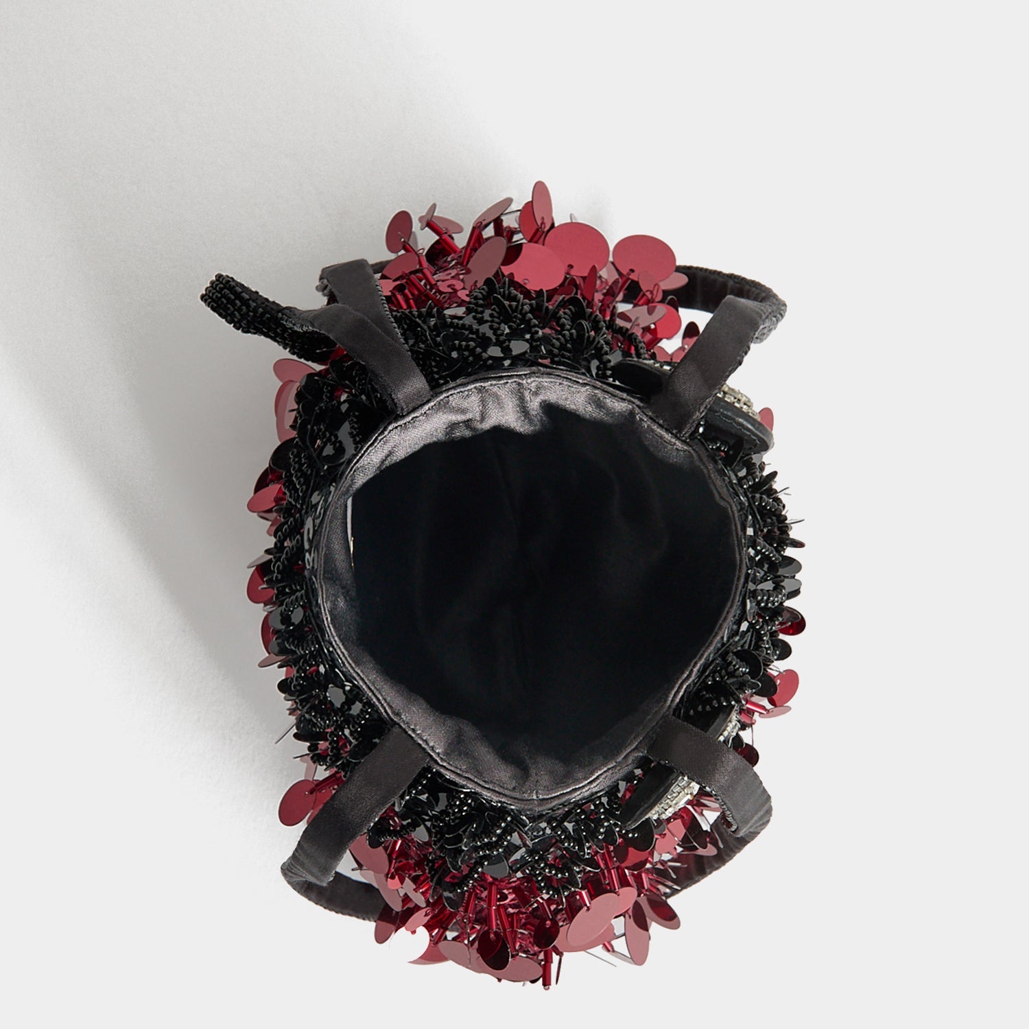 Ladybird Mini Bucket Bag -

          
            Sequins in black and red -
          

          Anya Hindmarch EU
