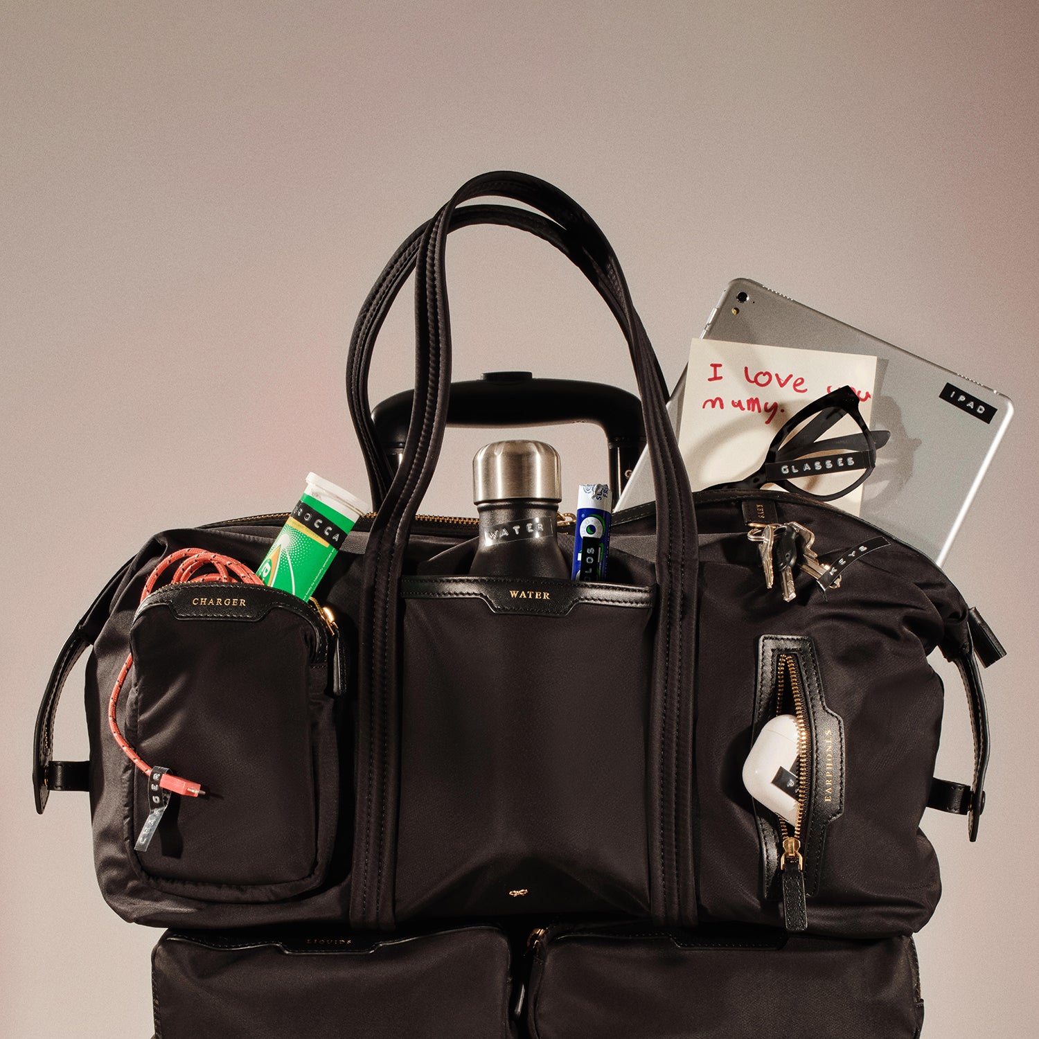 In-Flight Travel Bag -

          
            Regenerated Econyl® in Black -
          

          Anya Hindmarch EU
