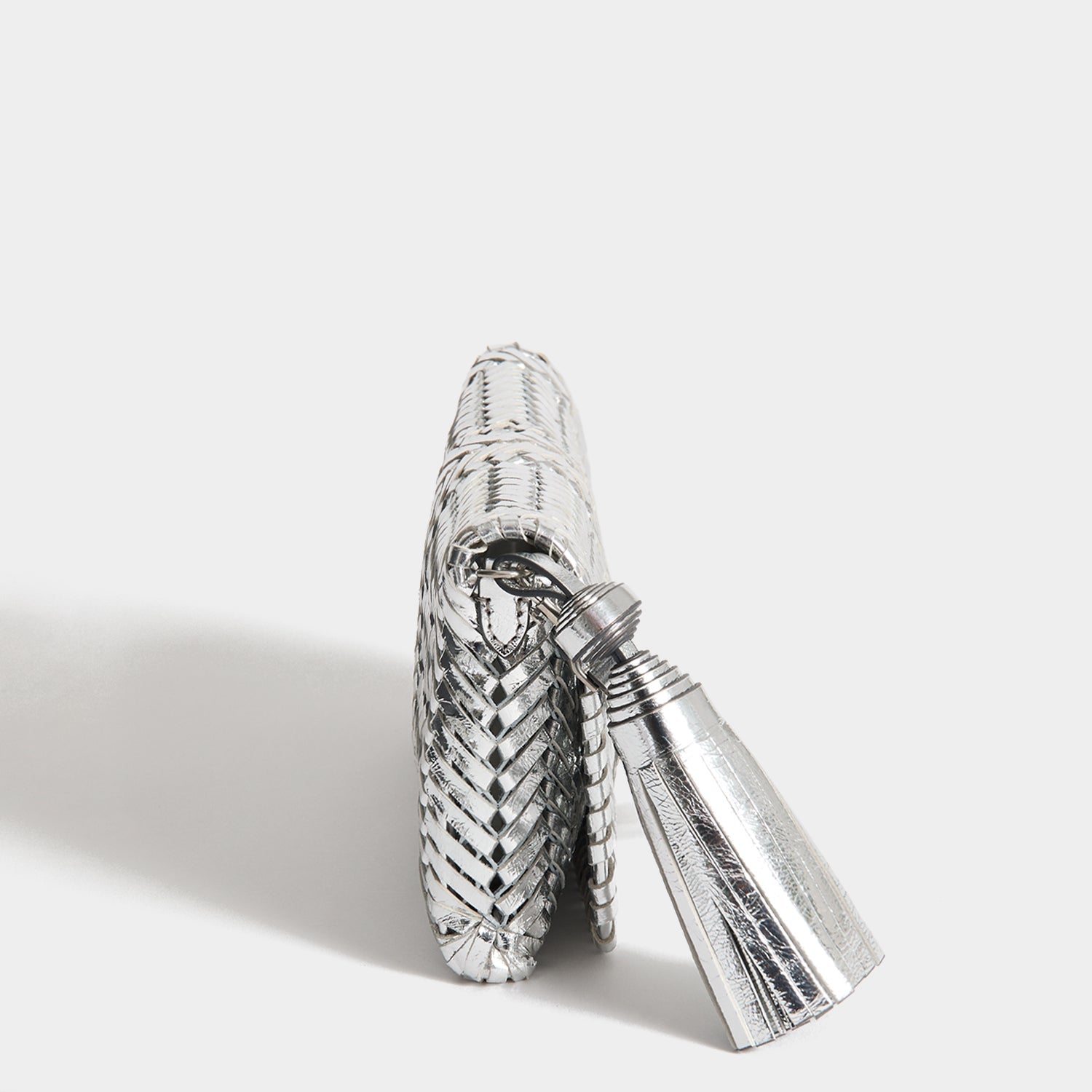 Neeson Tassel Clutch -

          
            Capra Leather in Silver -
          

          Anya Hindmarch EU
