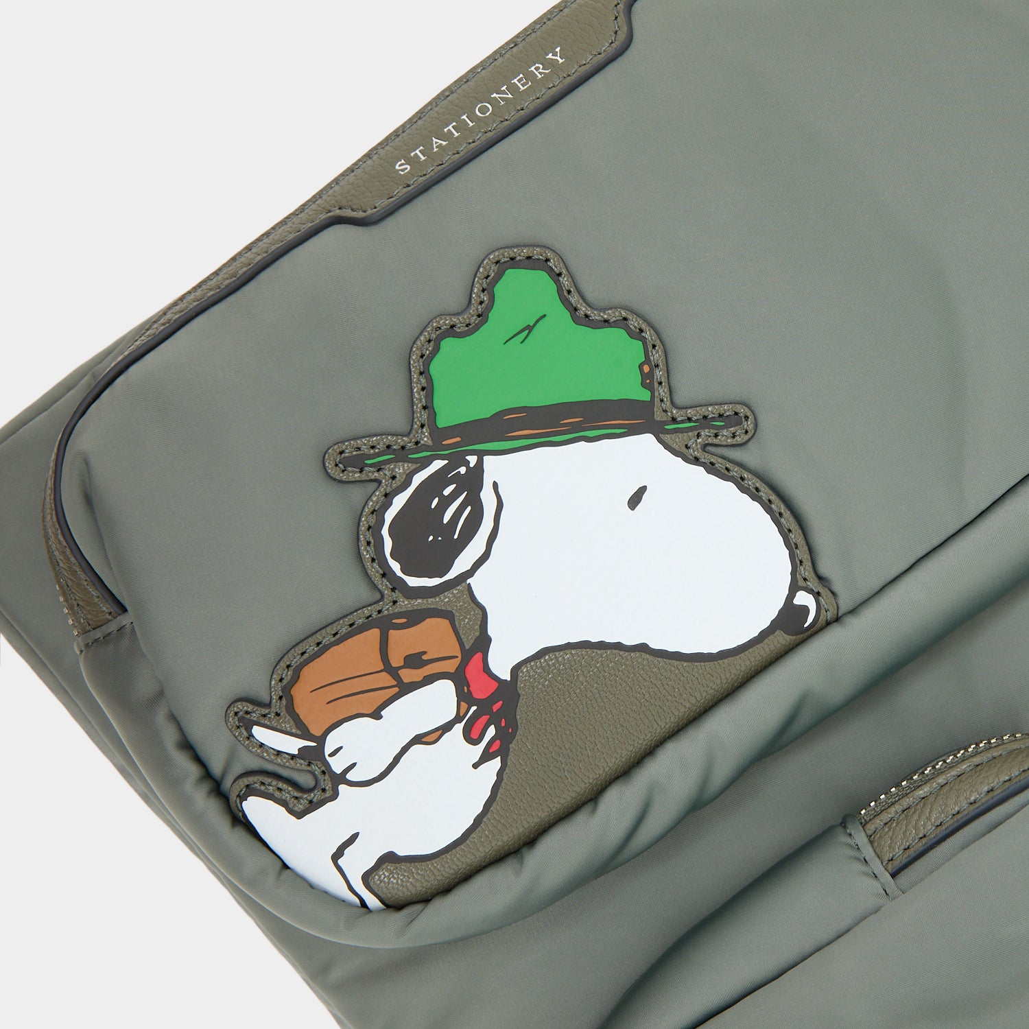 Peanuts Snoopy Tech Case -

          
            Recycled padded fabric in Fern Green -
          

          Anya Hindmarch EU
