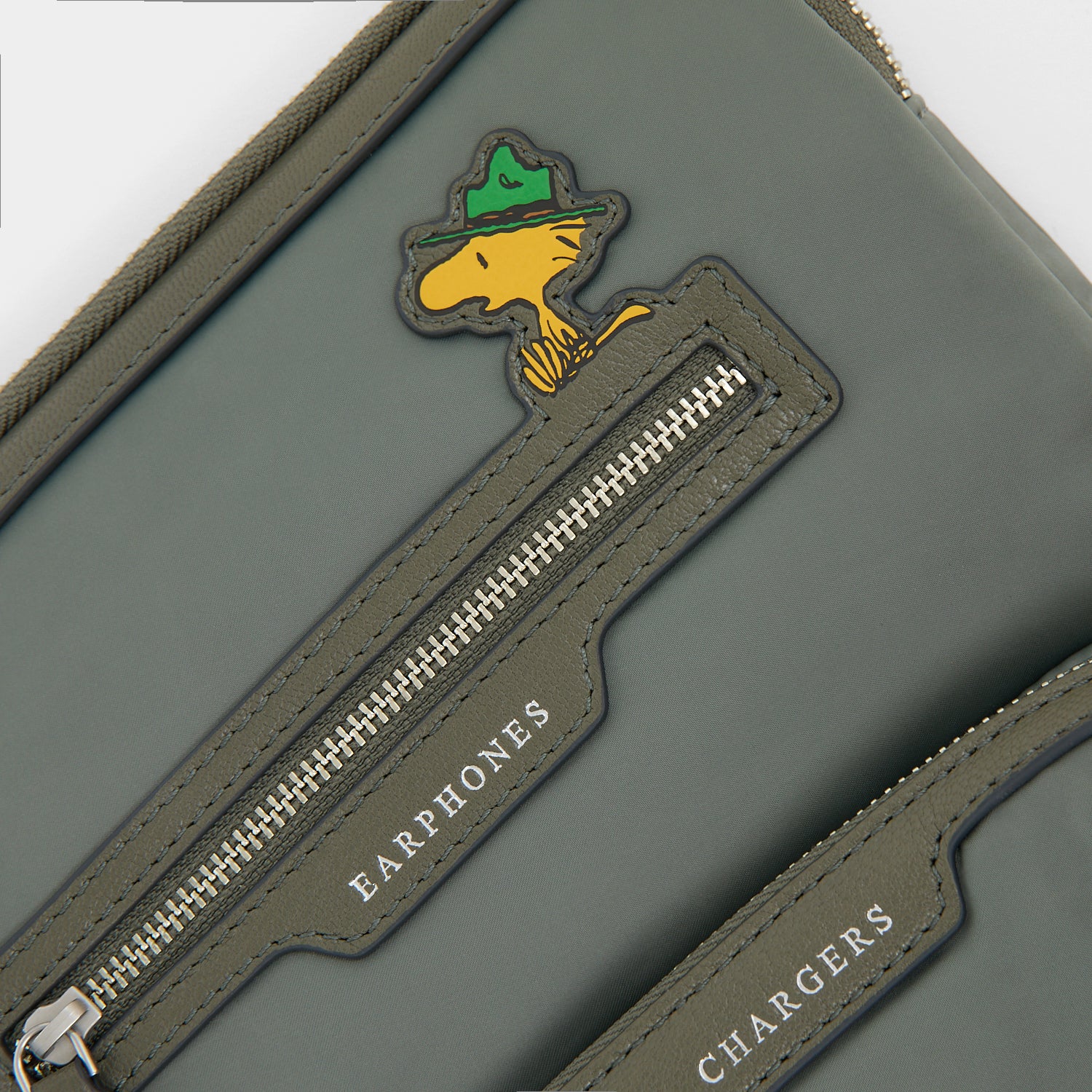 Peanuts Snoopy Tech Case -

          
            Recycled padded fabric in Fern Green -
          

          Anya Hindmarch EU
