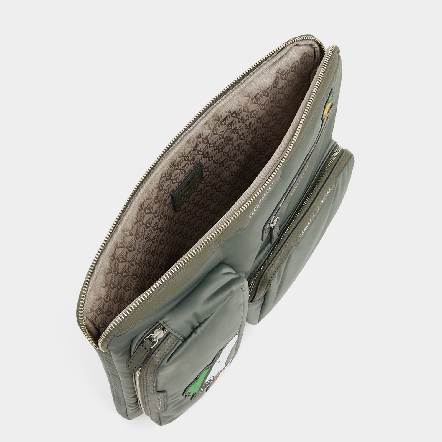 Peanuts Snoopy Tech Case -

          
            Recycled padded fabric in Fern Green -
          

          Anya Hindmarch EU
