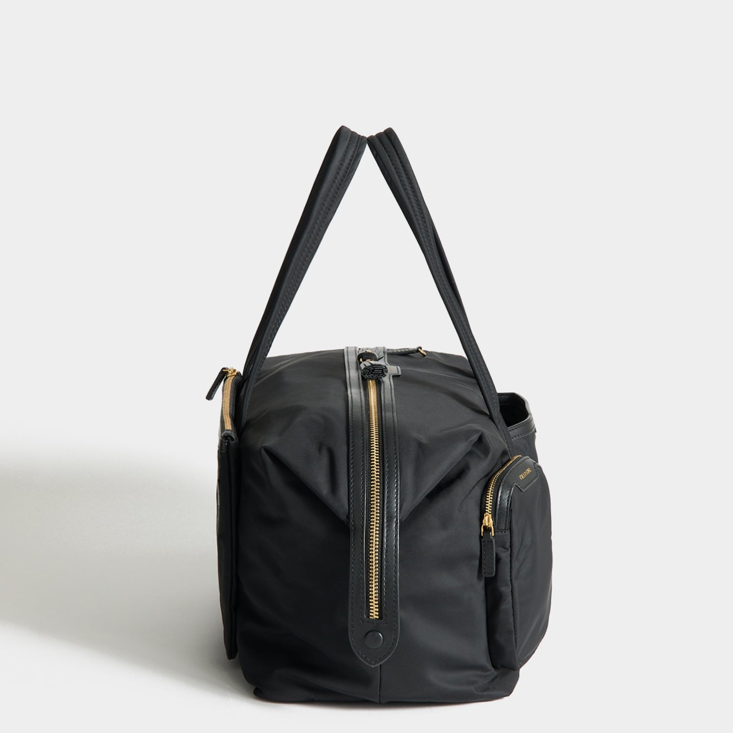 In-Flight Travel Bag -

          
            Regenerated Econyl® in Black -
          

          Anya Hindmarch EU
