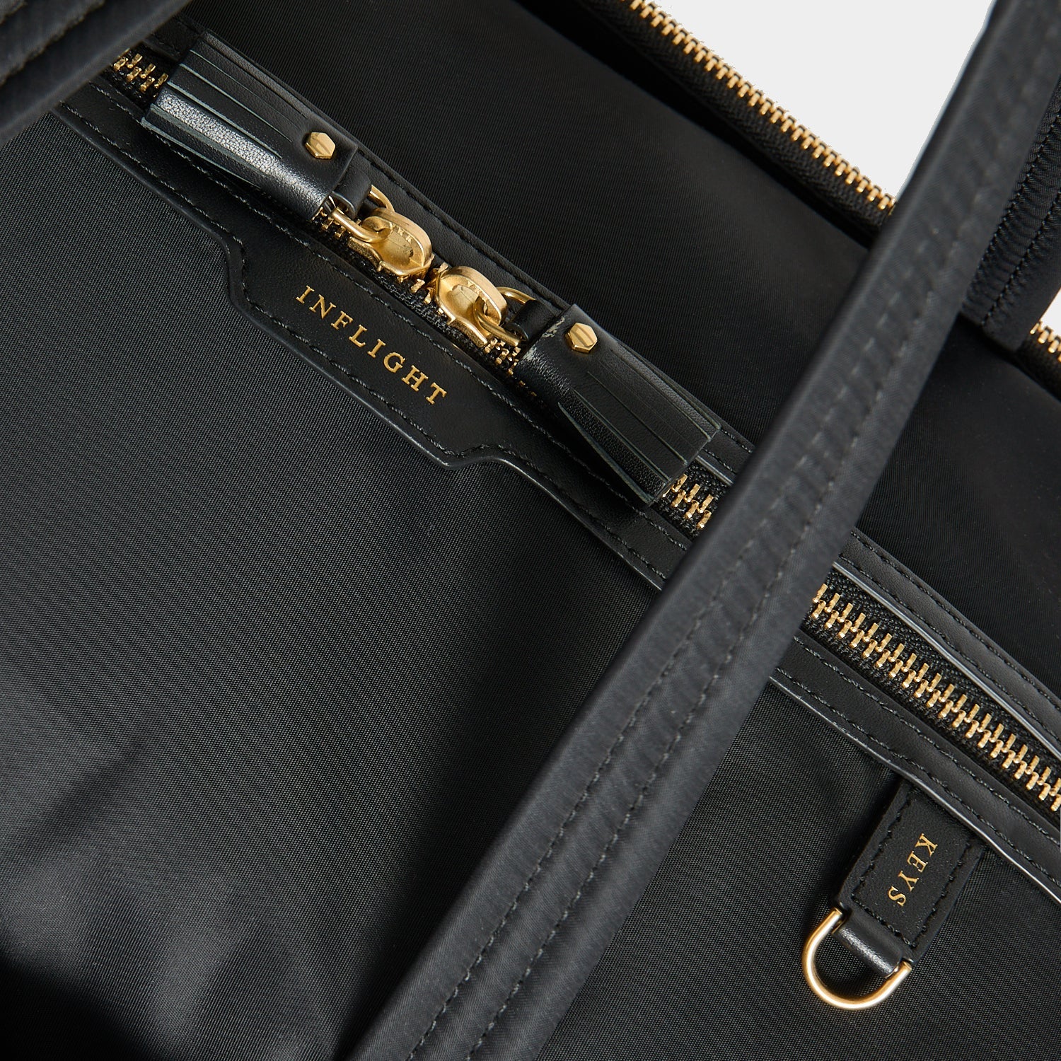 In-Flight Travel Bag -

          
            Regenerated Econyl® in Black -
          

          Anya Hindmarch EU
