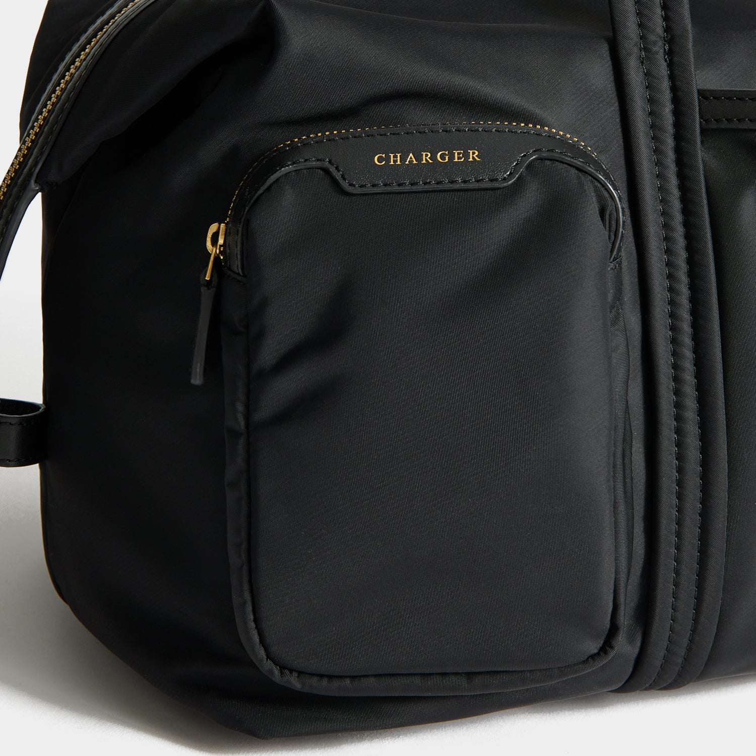 In-Flight Travel Bag -

          
            Regenerated Econyl® in Black -
          

          Anya Hindmarch EU
