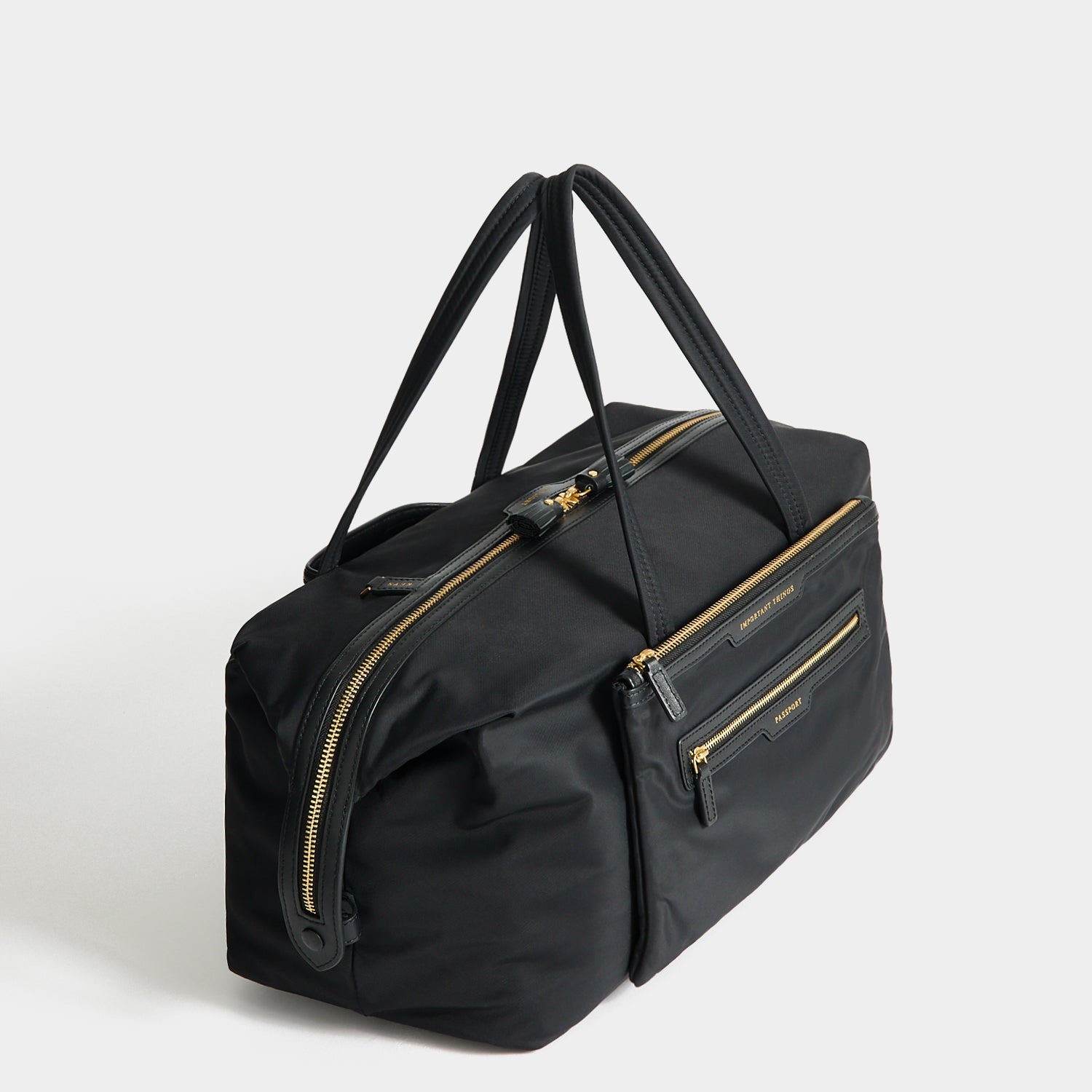 In-Flight Travel Bag -

          
            Regenerated Econyl® in Black -
          

          Anya Hindmarch EU
