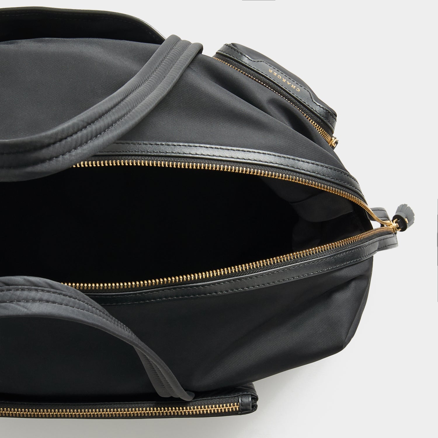 In-Flight Travel Bag -

          
            Regenerated Econyl® in Black -
          

          Anya Hindmarch EU
