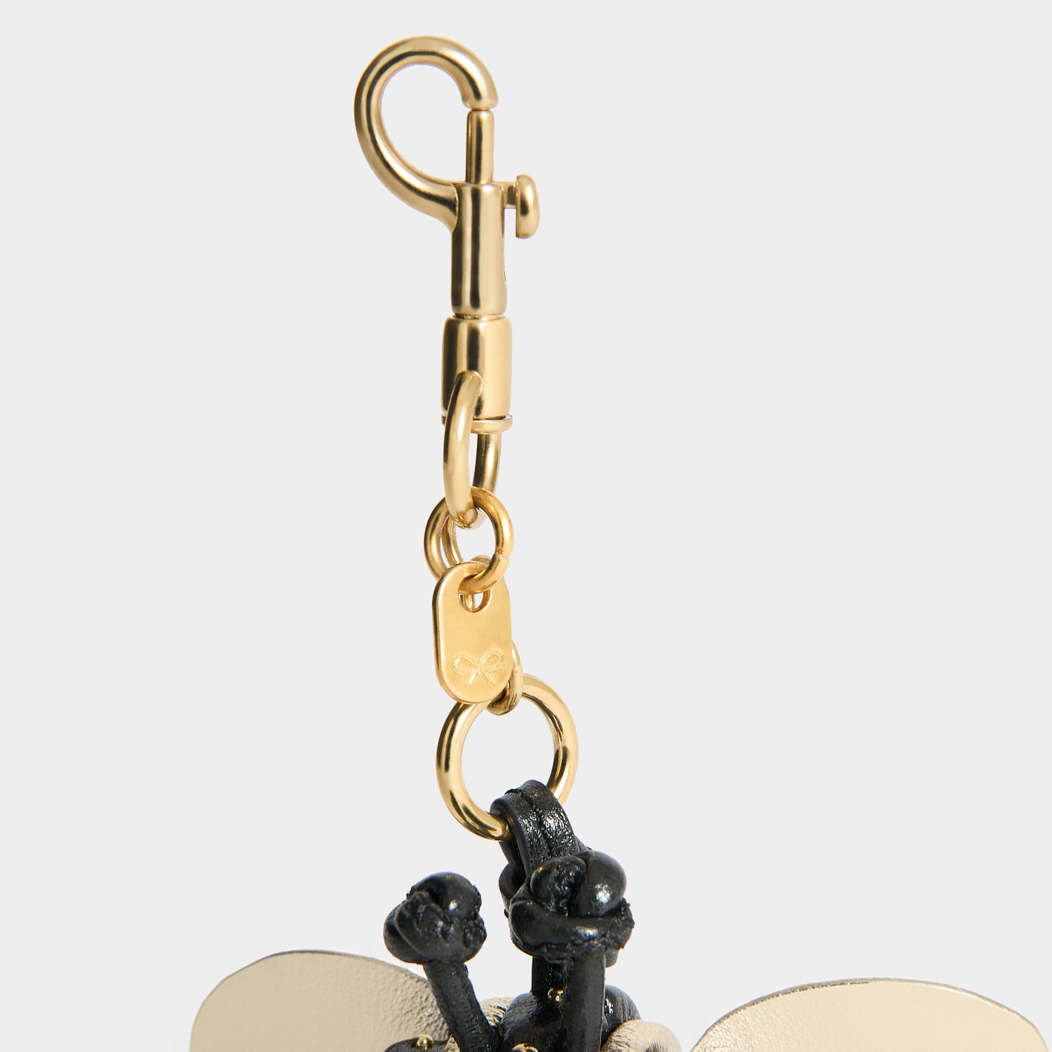 Bee Charm -

          
            Capra Leather in black -
          

          Anya Hindmarch EU
