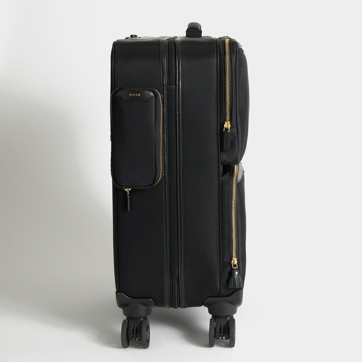 Short-Haul Suitcase -

          
            Econyl® Regenerated Nylon in Black -
          

          Anya Hindmarch EU
