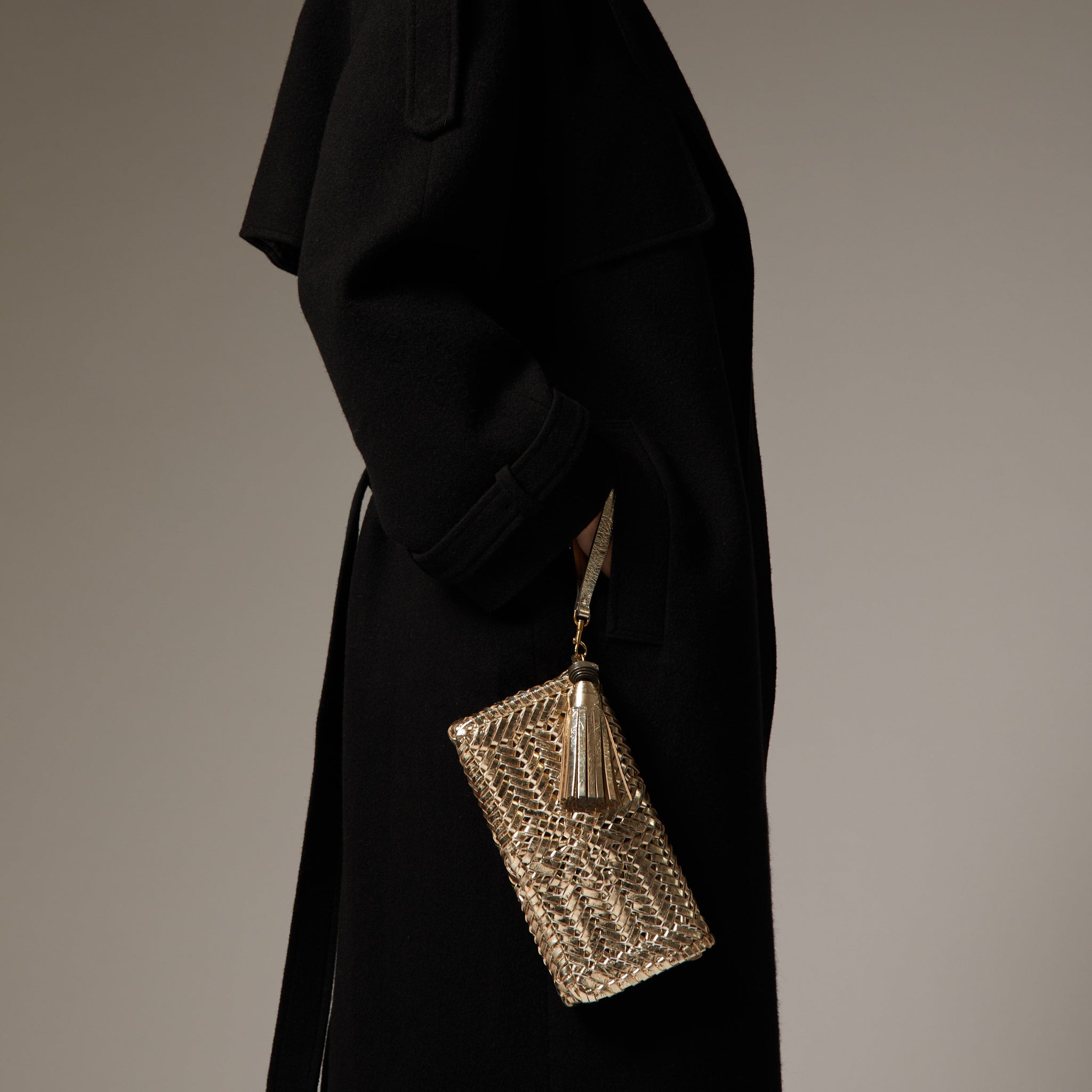 Neeson Tassel Clutch -

                  
                    Capra Leather in Gold -
                  

                  Anya Hindmarch EU
