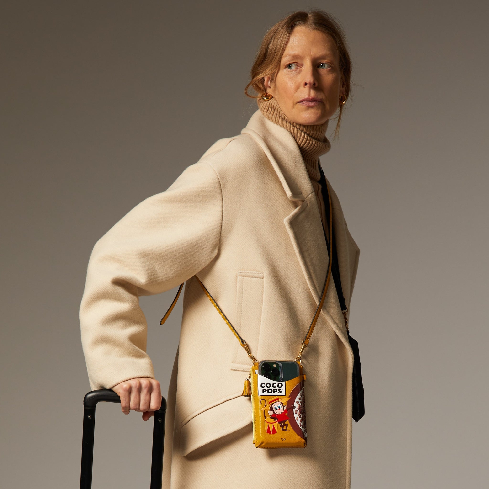 Anya Brands Coco Pops Zip Phone Pouch on Strap -

                  
                    Shiny Capra Leather in Mustard -
                  

                  Anya Hindmarch EU
