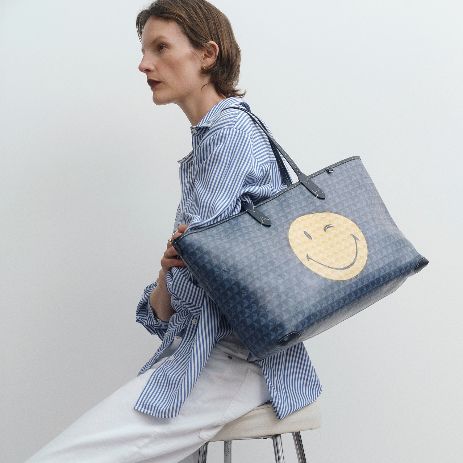 I am a Plastic Bag Wink Zipped Tote -

          
            Recycled Canvas in Marine -
          

          Anya Hindmarch EU
