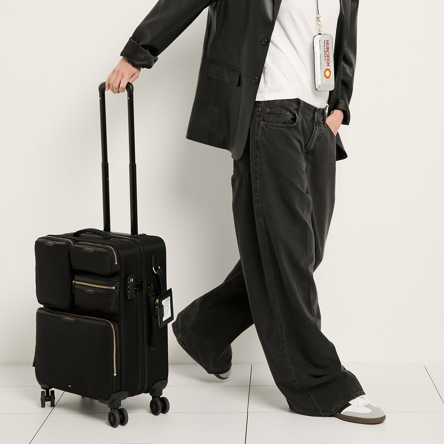 Short-Haul Suitcase -

          
            Econyl® Regenerated Nylon in Black -
          

          Anya Hindmarch EU
