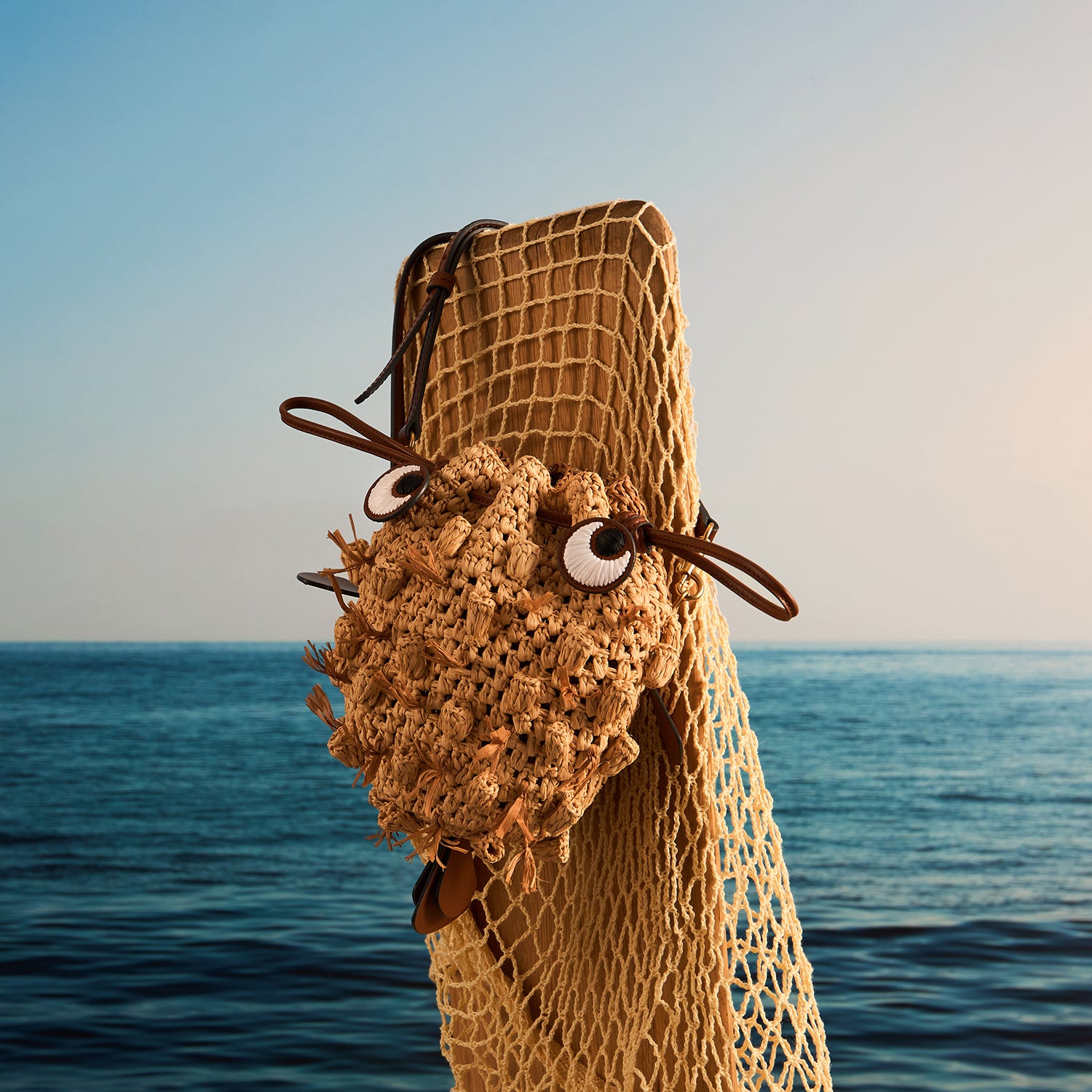 Raffia Blowfish Cross-body -

          
            Natural Raffia/Smooth Leather in Natural -
          

          Anya Hindmarch EU
