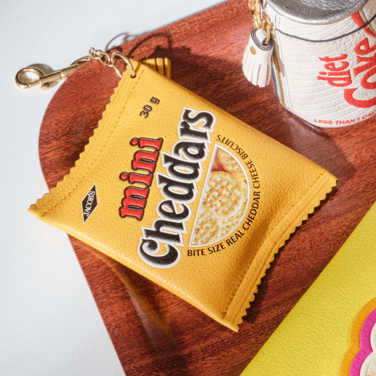 Anya Brands Jacob's Mini Cheddars Earphone Case Charm -

          
            Calf Leather in Lemon Curd Yellow -
          

          Anya Hindmarch EU
