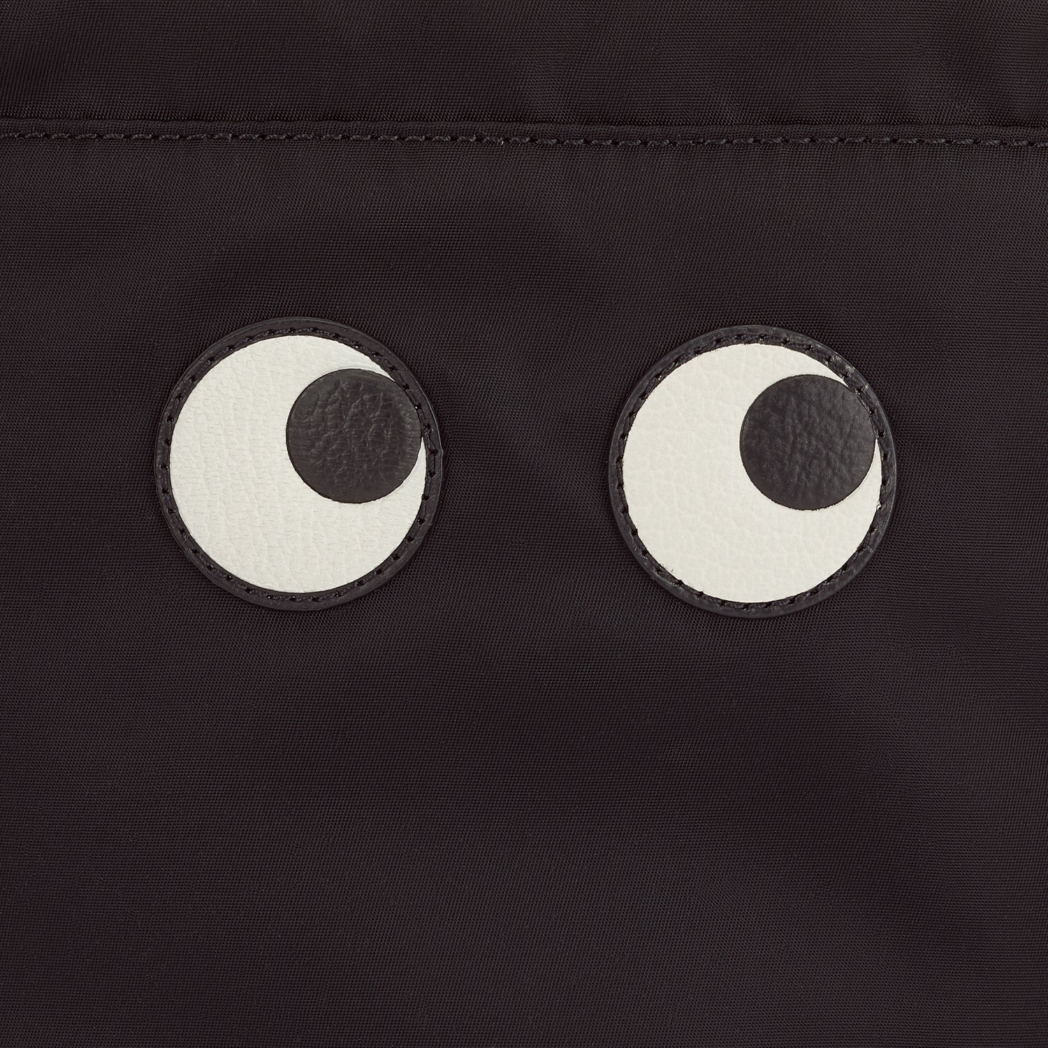 Eyes Drawstring Pouch -

          
            Econyl® Regenerated Nylon in Black -
          

          Anya Hindmarch EU
