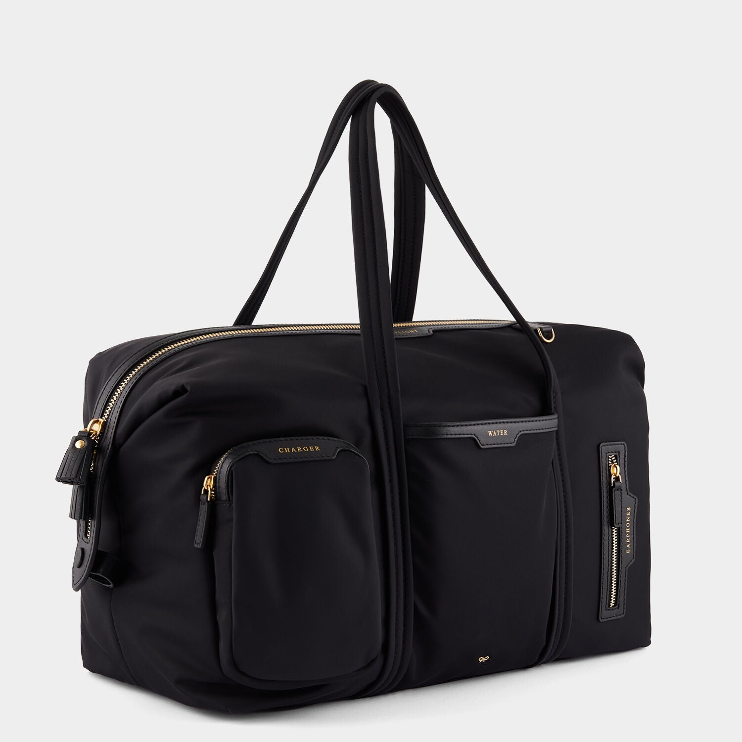 In-Flight Travel Bag -

          
            Regenerated Econyl® in Black -
          

          Anya Hindmarch EU
