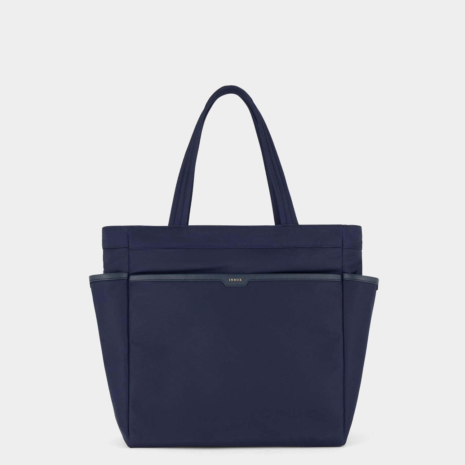 Commuter Tote -

          
            Regenerated Econyl® in Marine -
          

          Anya Hindmarch EU
