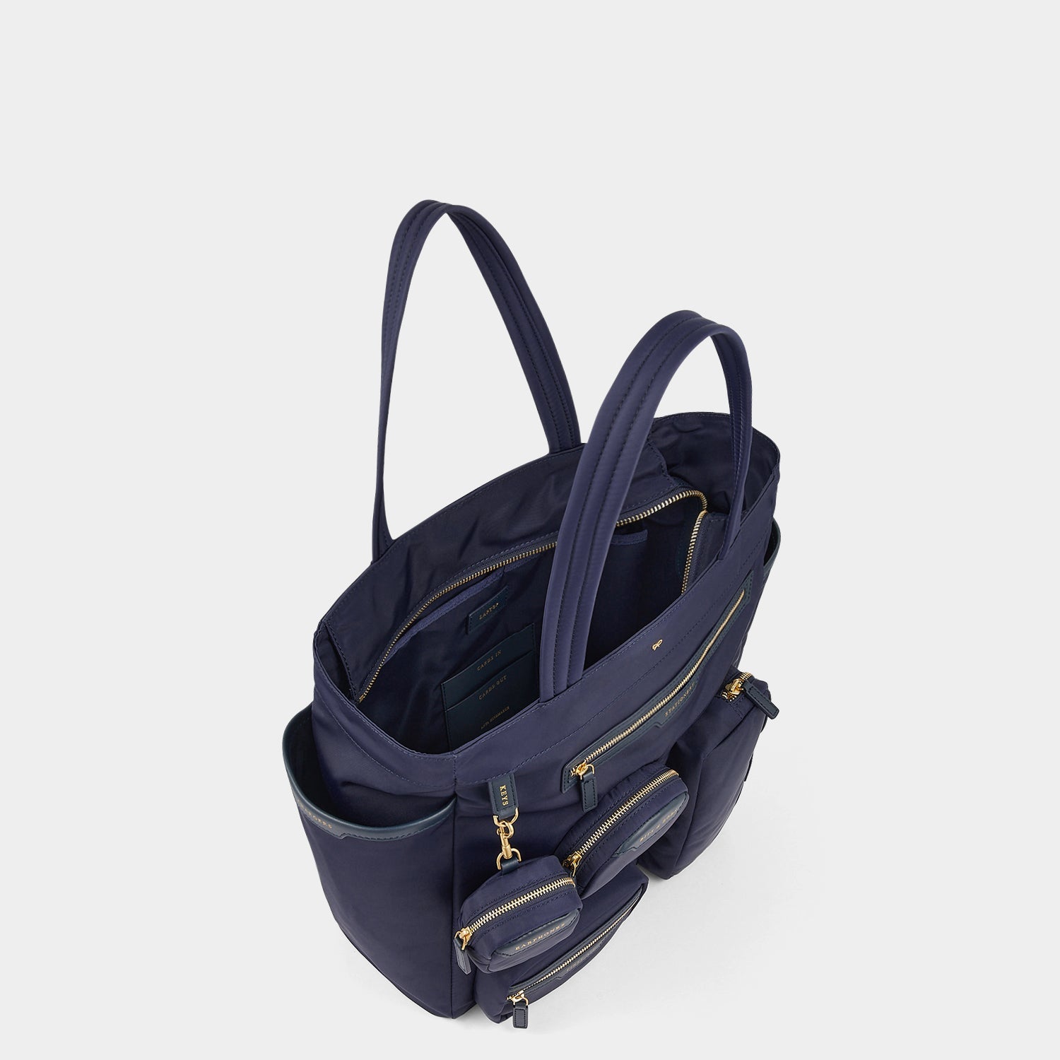 Commuter Tote -

          
            Regenerated Econyl® in Marine -
          

          Anya Hindmarch EU
