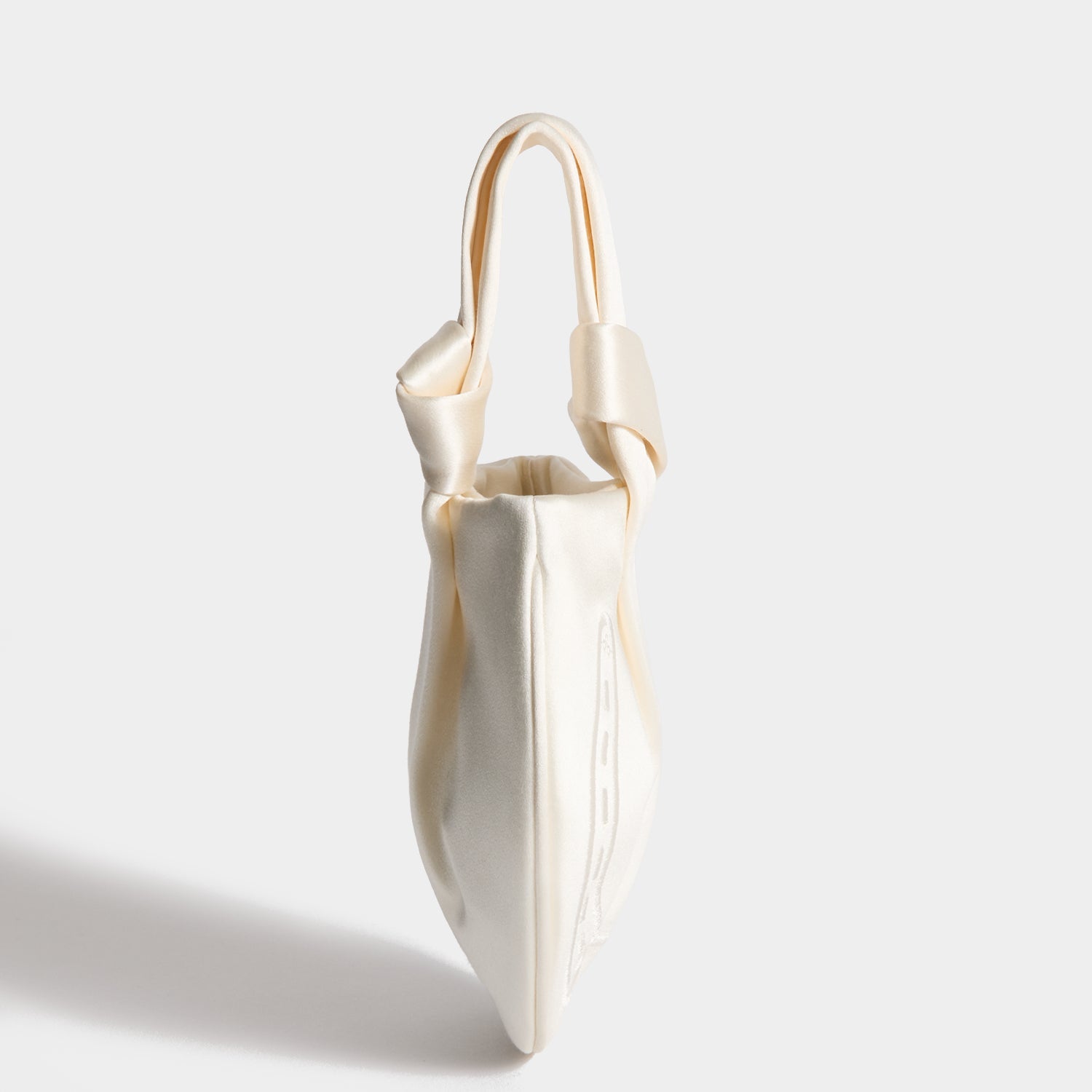 Tie the Knot Clutch -

          
            Double Satin in Ivory -
          

          Anya Hindmarch EU
