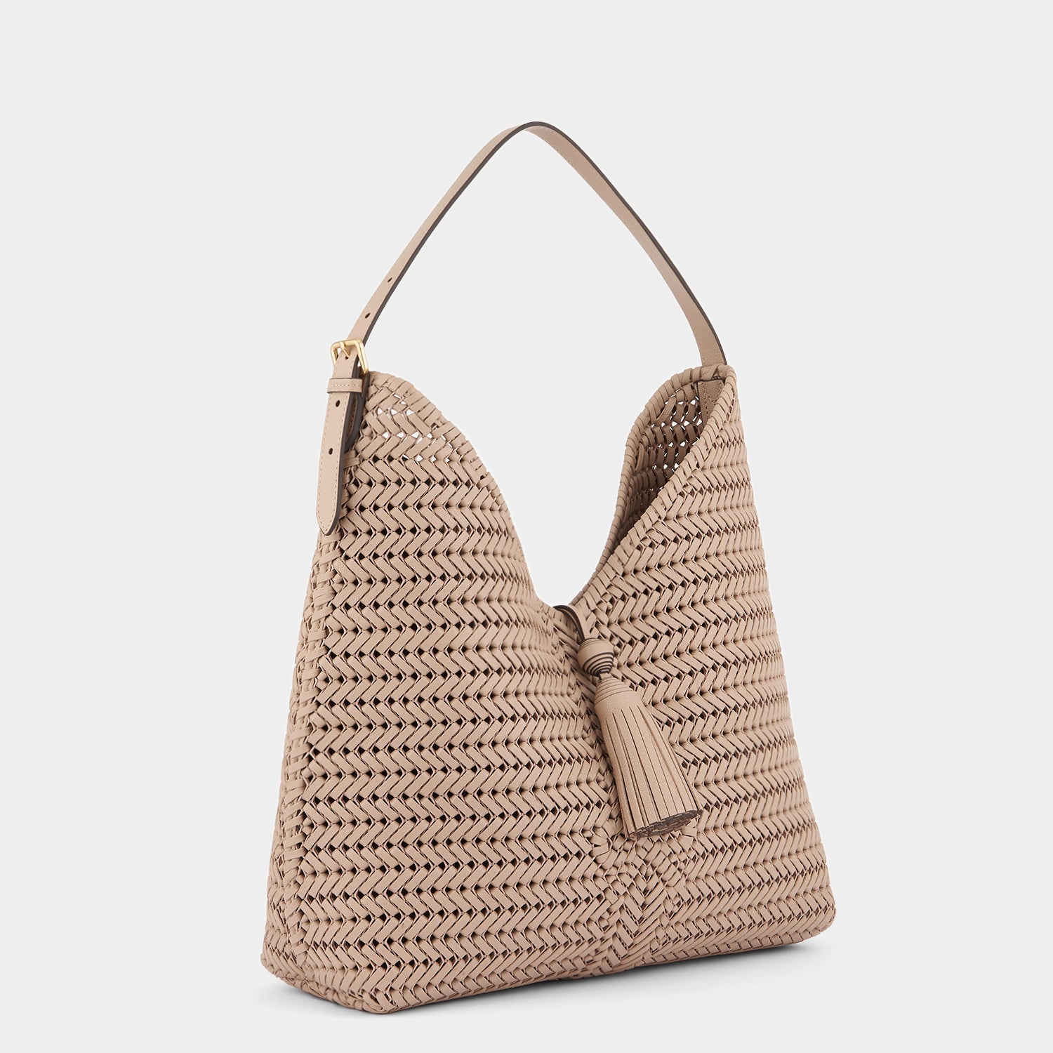 The Neeson Tassel Hobo -

                  
                    Capra Leather in Light Nude -
                  

                  Anya Hindmarch EU
