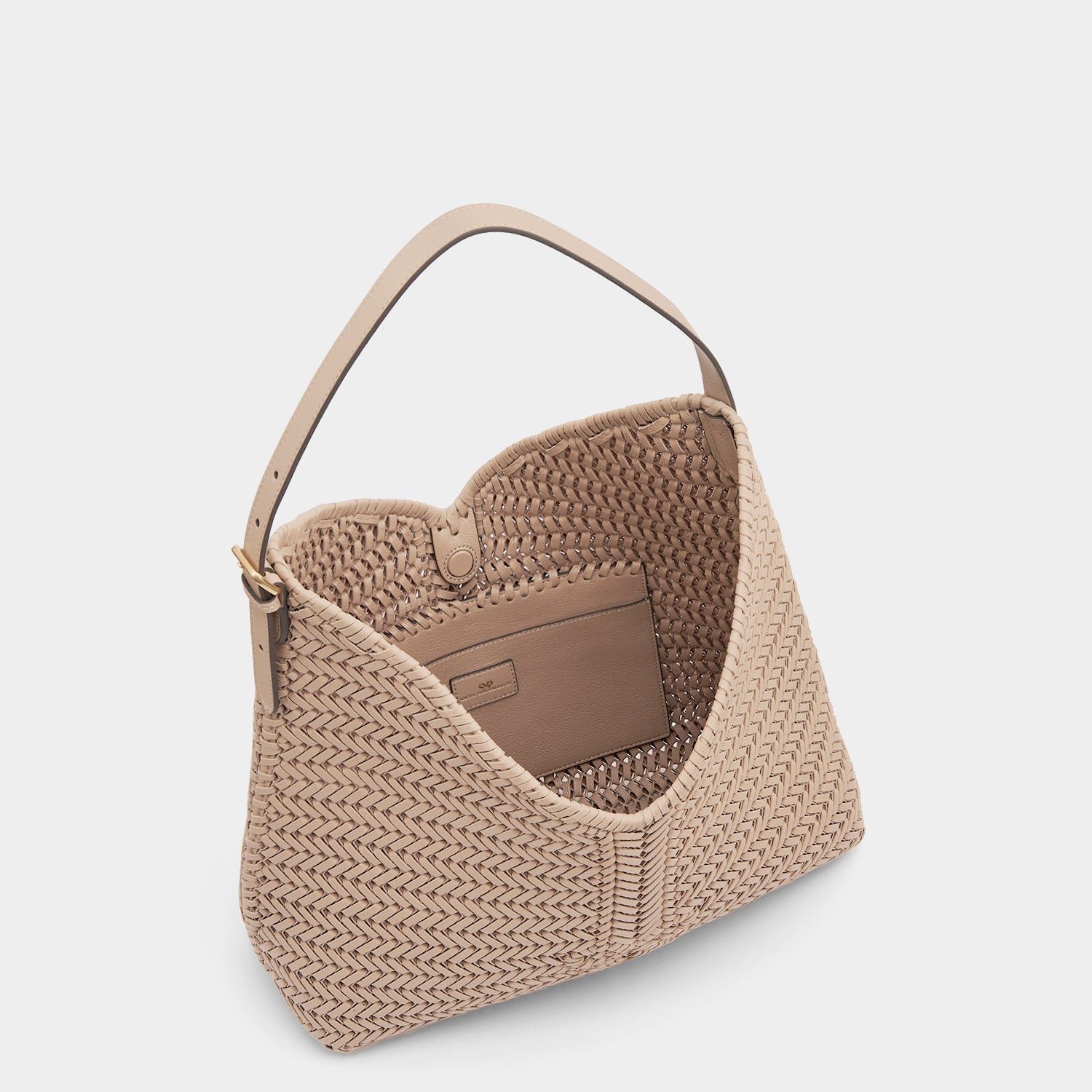 The Neeson Tassel Hobo -

                  
                    Capra Leather in Light Nude -
                  

                  Anya Hindmarch EU
