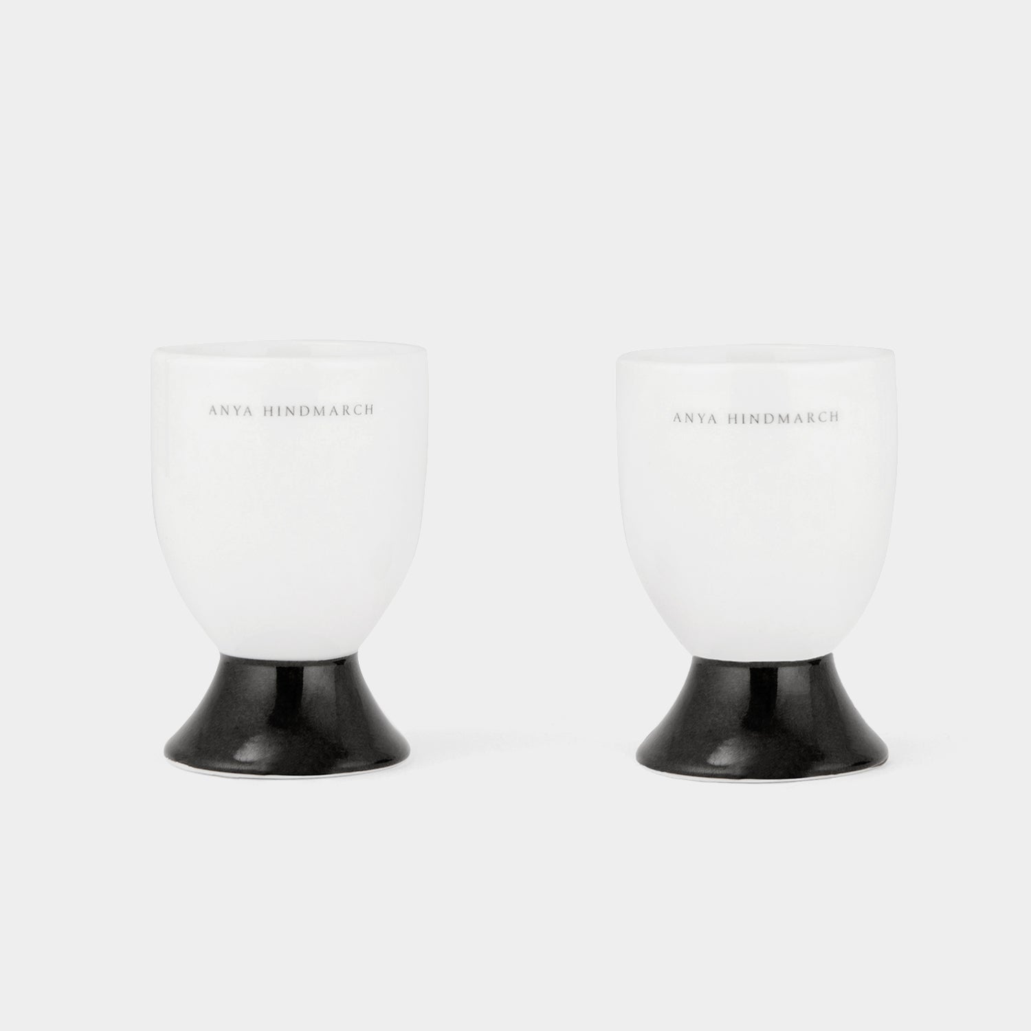 Eyes Egg Cup Set -

          
            Bone China in White -
          

          Anya Hindmarch EU
