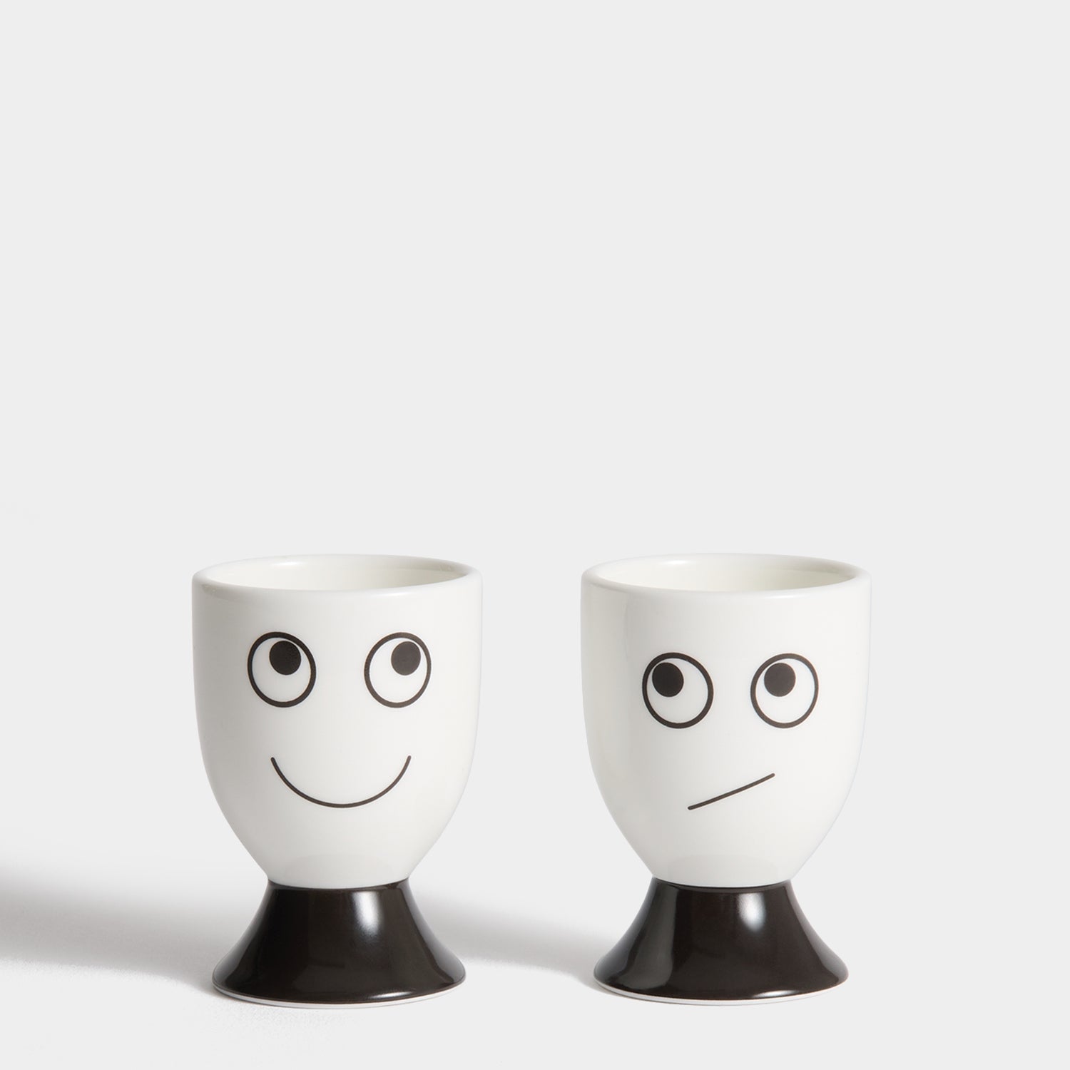 Eyes Egg Cup Set -

          
            Bone China in White -
          

          Anya Hindmarch EU
