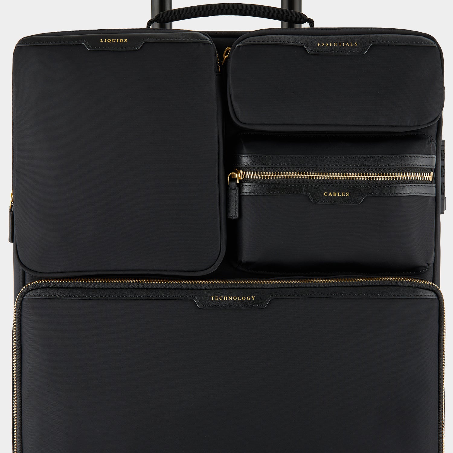 Short-Haul Suitcase -

                  
                    Econyl® Regenerated Nylon in Black -
                  

                  Anya Hindmarch EU
