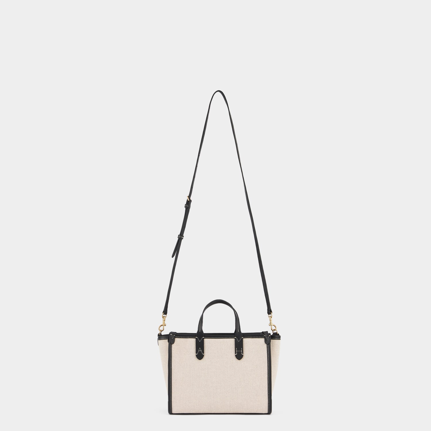 Pocket XS Cross-body Tote -

          
            Mixed Canvas in Natural -
          

          Anya Hindmarch EU
