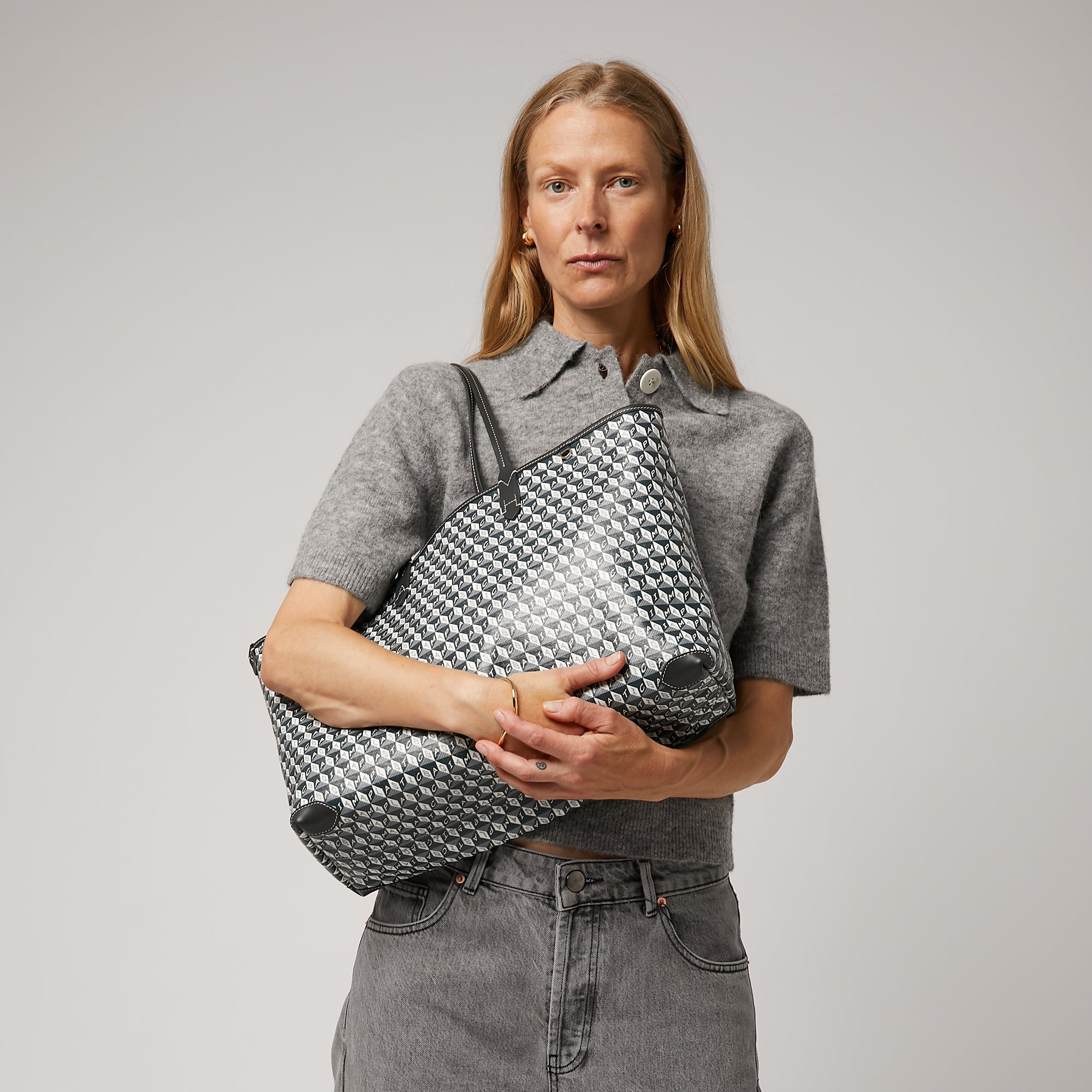 I Am A Plastic Bag Tote -

                  
                    Recycled Coated Canvas in Charcoal -
                  

                  Anya Hindmarch EU
