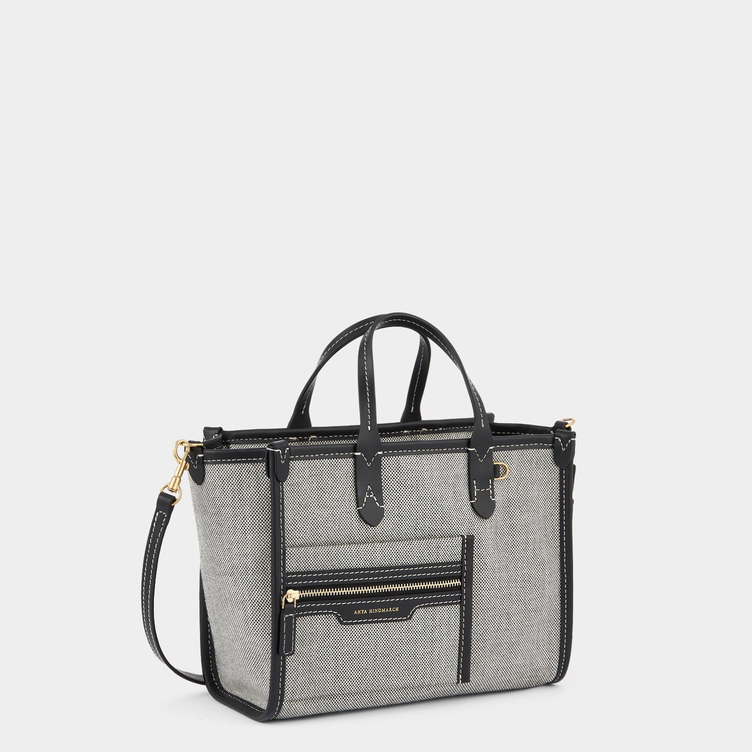 Pocket XS Cross-body Tote -

                  
                    Mixed Canvas in Salt And Pepper -
                  

                  Anya Hindmarch EU
