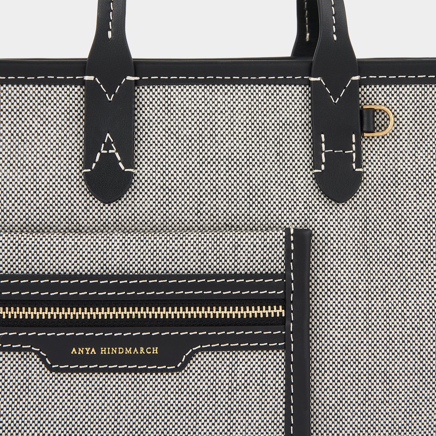Pocket XS Cross-body Tote -

                  
                    Mixed Canvas in Salt And Pepper -
                  

                  Anya Hindmarch EU
