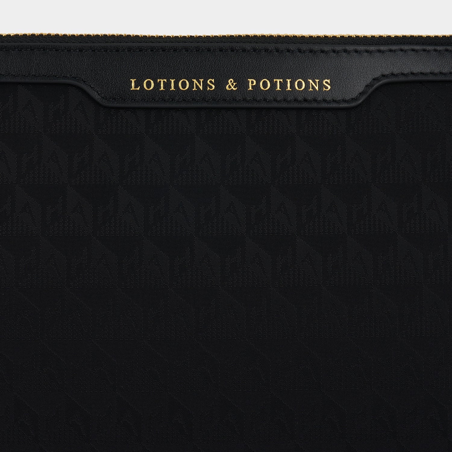 Logo Lotions and Potions Pouch -

                  
                    Recycled Nylon in Black -
                  

                  Anya Hindmarch EU
