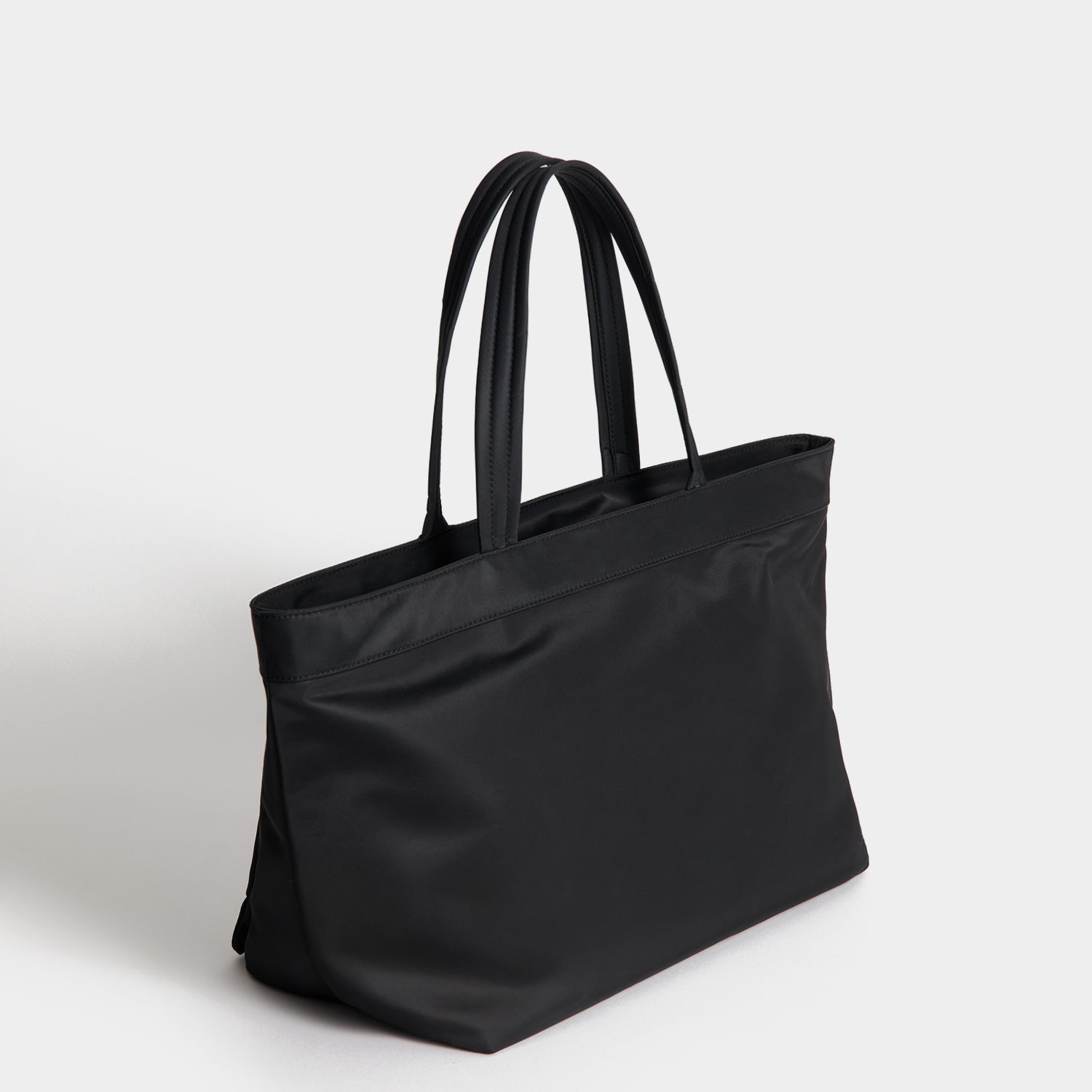 E/W Multi Pocket Tote -

          
            Regenerated ECONYL® in Black -
          

          Anya Hindmarch EU

