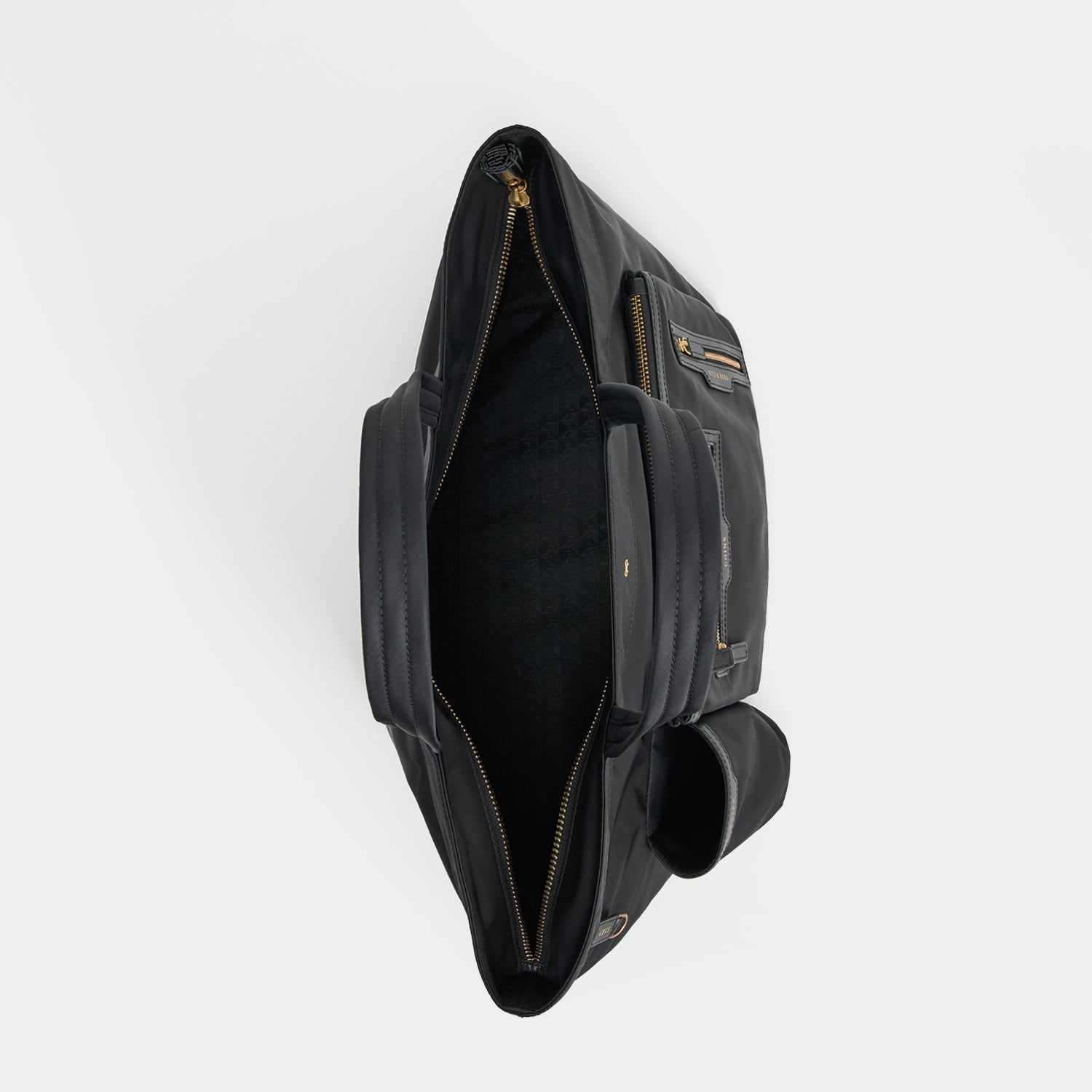 E/W Multi Pocket Tote -

          
            Regenerated ECONYL® in Black -
          

          Anya Hindmarch EU
