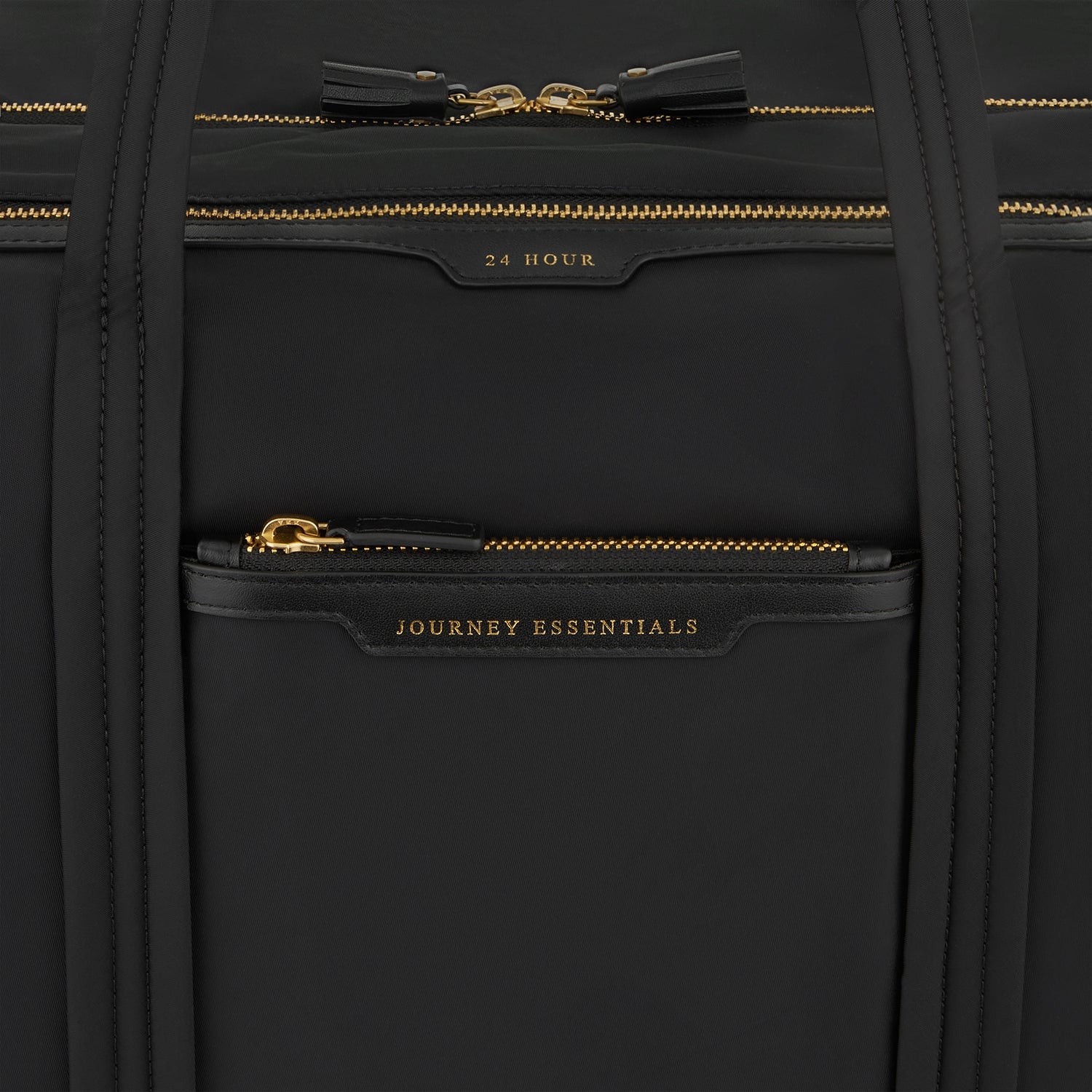 24 Hour Travel Bag -

          
            Regenerated ECONYL® in Black -
          

          Anya Hindmarch EU
