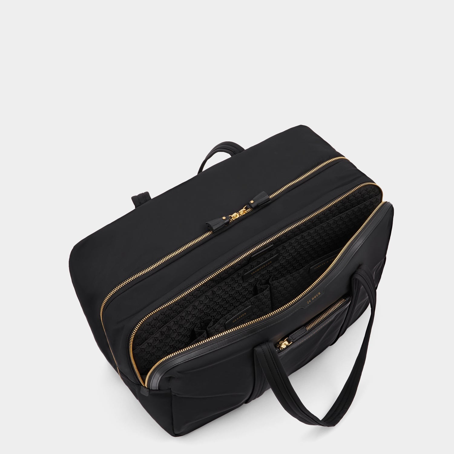 24 Hour Travel Bag -

          
            Regenerated ECONYL® in Black -
          

          Anya Hindmarch EU
