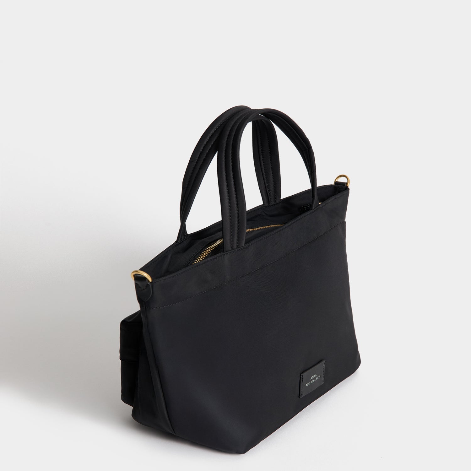 E/W Eyes Mini Cross-body Tote -

          
            Regenerated ECONYL® in Black -
          

          Anya Hindmarch EU
