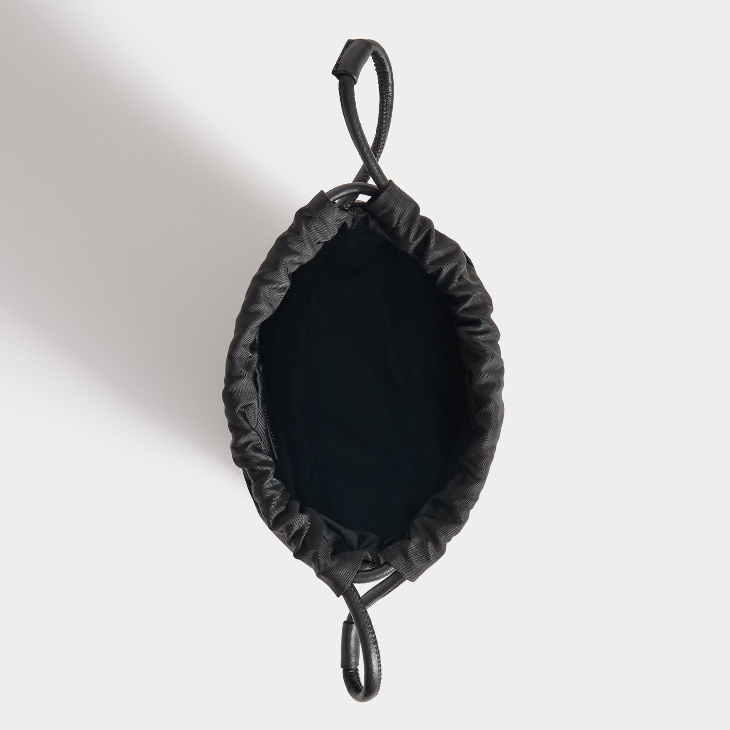 Eyes Drawstring Pouch -

          
            Regenerated ECONYL® in Black -
          

          Anya Hindmarch EU
