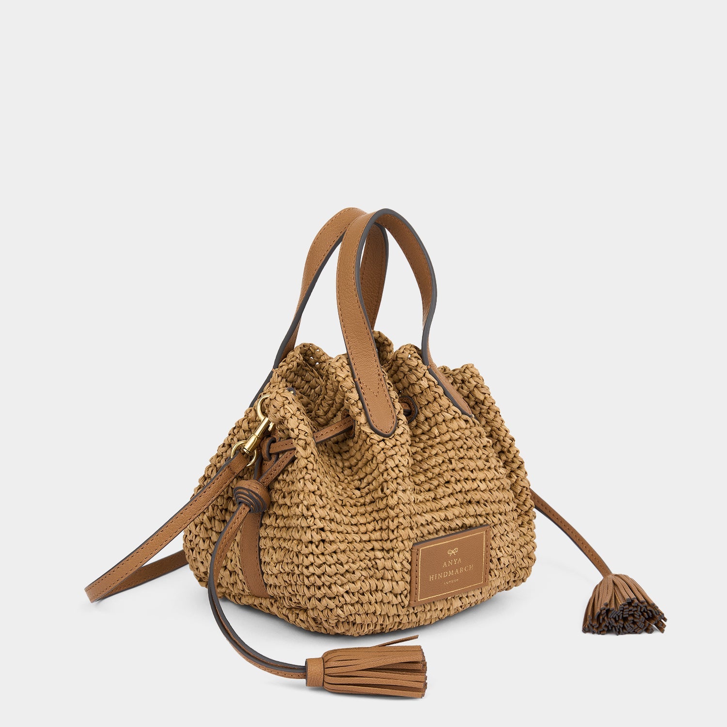 Raffia Drawstring Small Cross-body Tote -

          
            Raffia in Pecan -
          

          Anya Hindmarch EU
