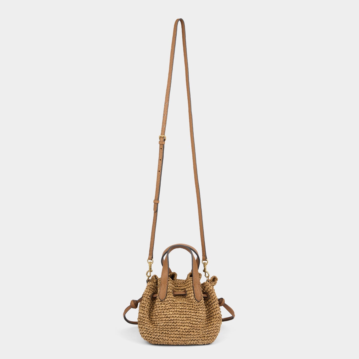 Raffia Drawstring Small Cross-body Tote -

          
            Raffia in Pecan -
          

          Anya Hindmarch EU
