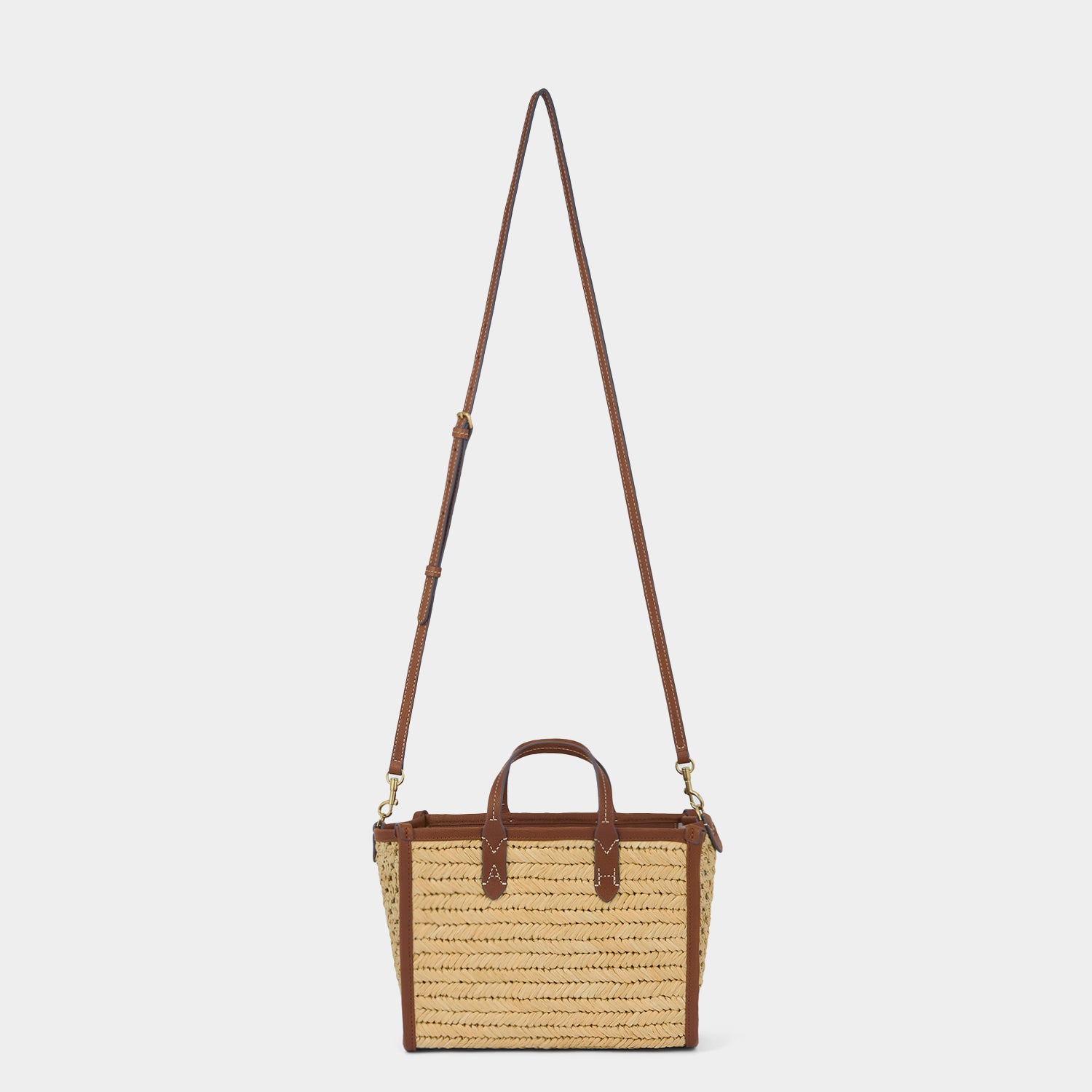 Raffia Pocket XS Cross-body Tote -

          
            Raffia in Cedar -
          

          Anya Hindmarch EU
