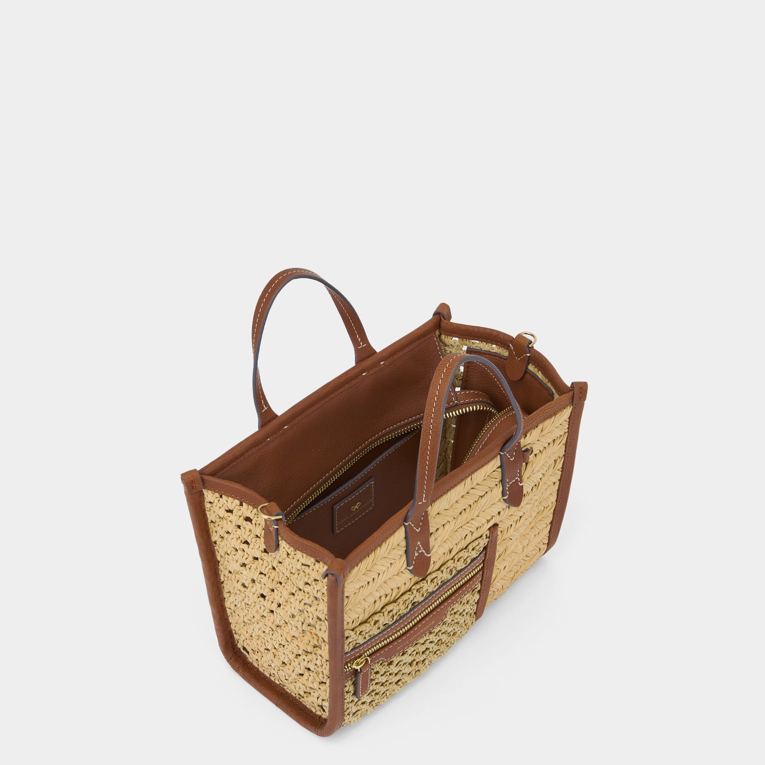 Raffia Pocket XS Cross-body Tote -

          
            Raffia in Cedar -
          

          Anya Hindmarch EU
