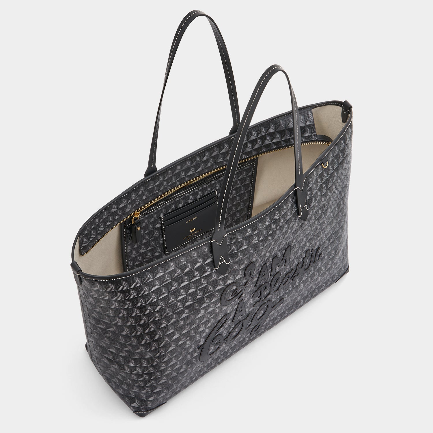 I Am A Plastic Bag Zipped Motif Tote -

          
            Recycled Canvas in Black -
          

          Anya Hindmarch EU
