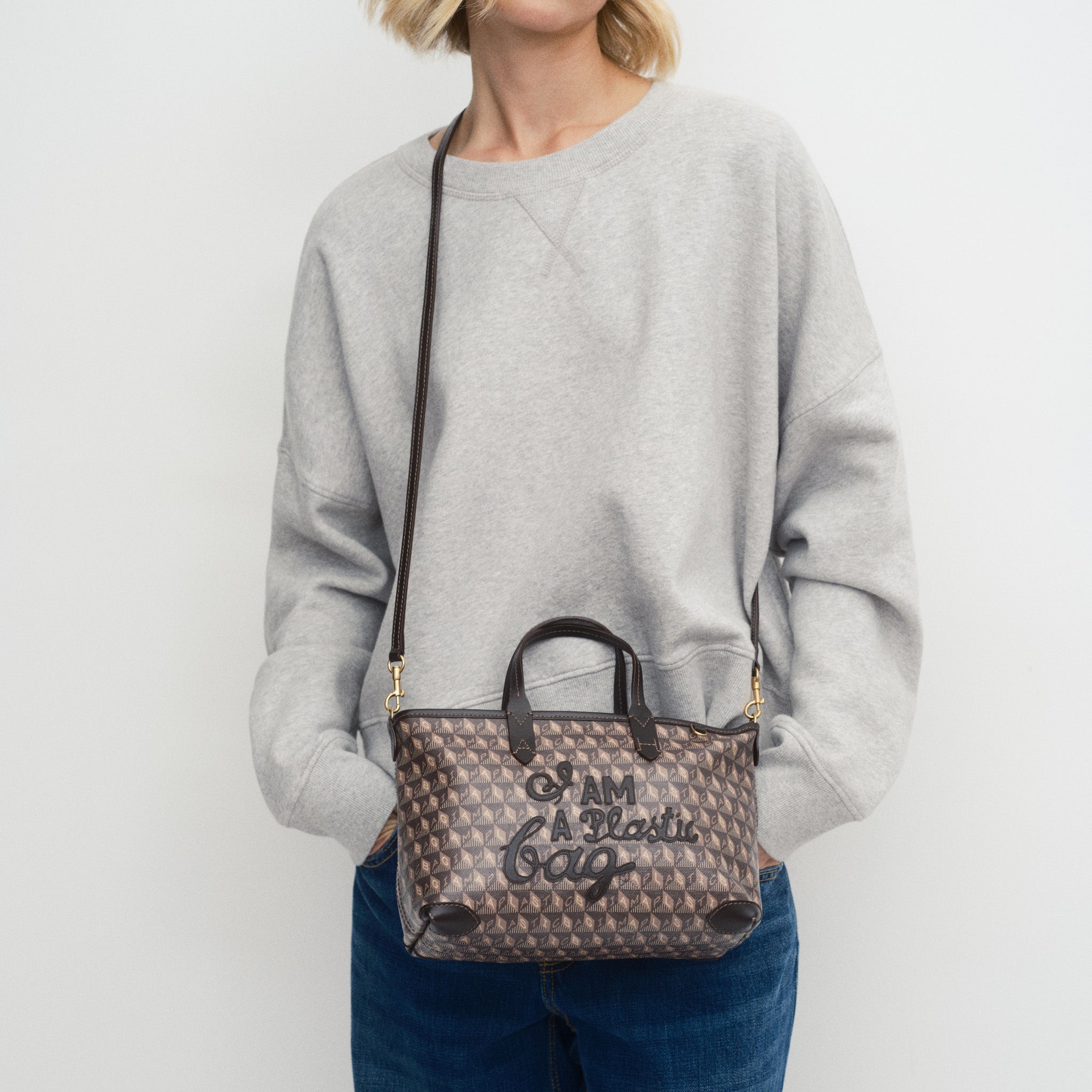 I Am A Plastic Bag XS Zipped Motif Cross-body Tote -

          
            Recycled Canvas in Truffle -
          

          Anya Hindmarch EU
