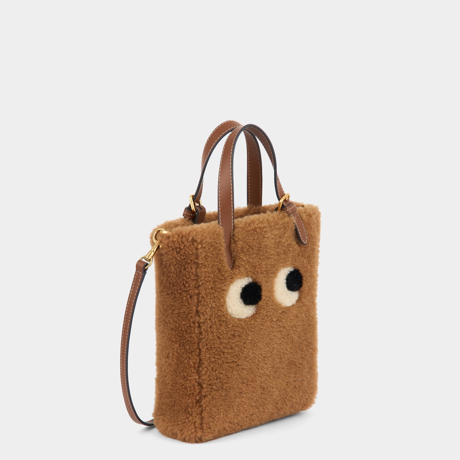 Mini N/S Eyes Shearling Cross-body Tote -

          
            Shearling in Sepia -
          

          Anya Hindmarch EU
