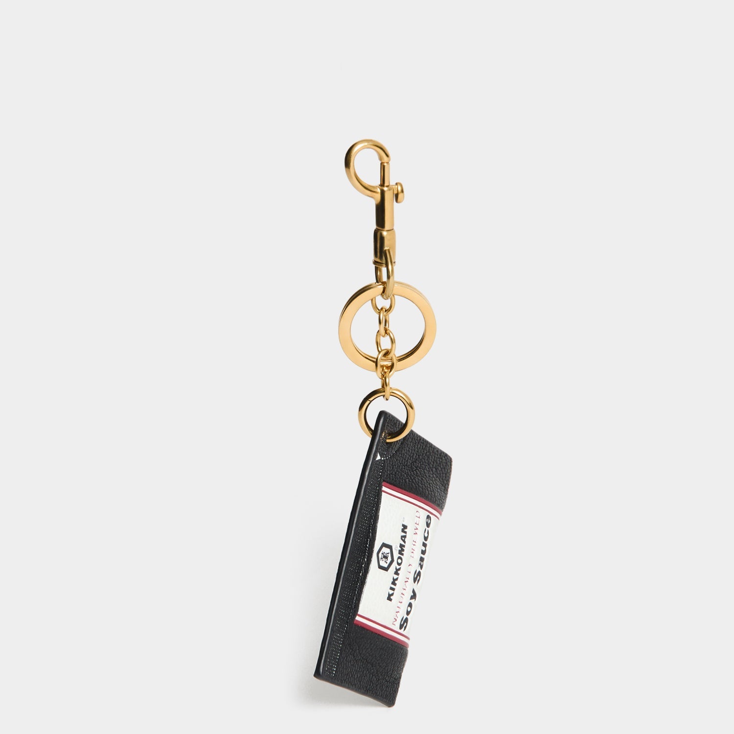 Anya Brands Kikkoman Charm -

          
            Capra Leather in Black -
          

          Anya Hindmarch EU
