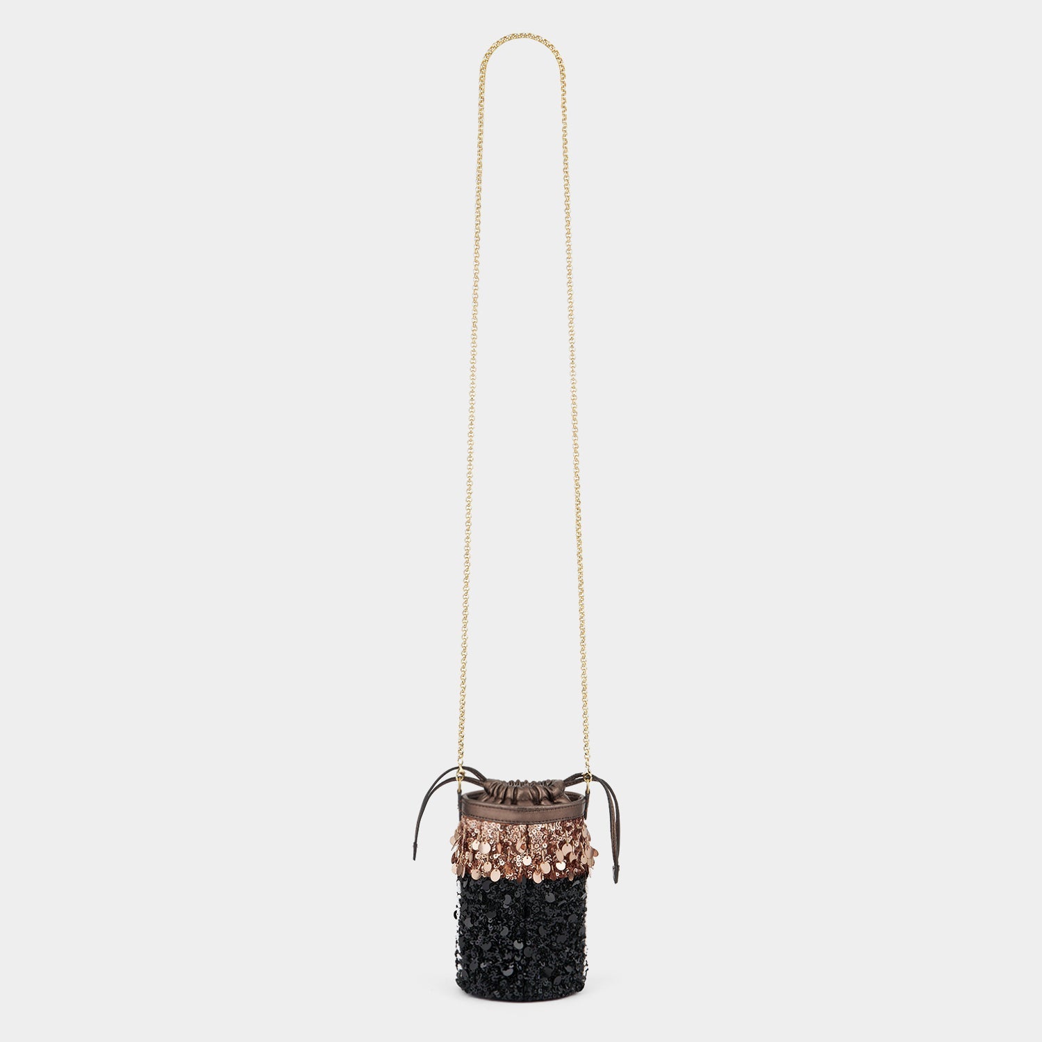 Anya Brands Duracell Mini Bucket Bag -

          
            Sequins in Black -
          

          Anya Hindmarch EU
